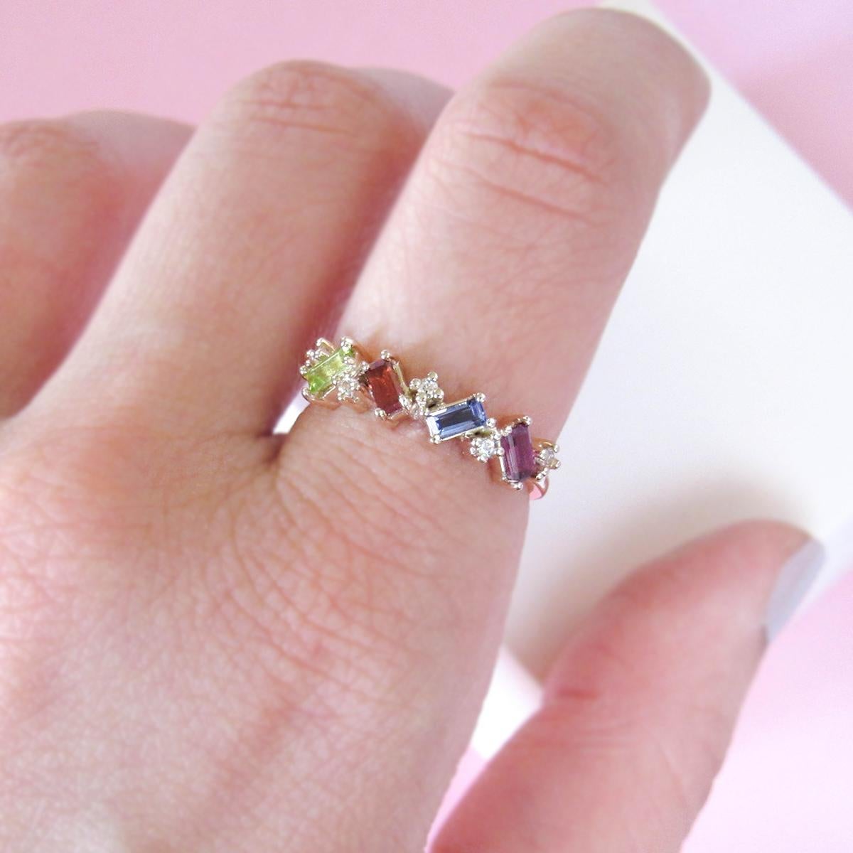 MADE TO ORDER *Please note that we take 45 business days to create your jewel before its ready to ship.  

A 14K rose gold ring, mix and matching baguette and round cut gemstones. The combination of colors is cheerful and lively. 

Gemstones: