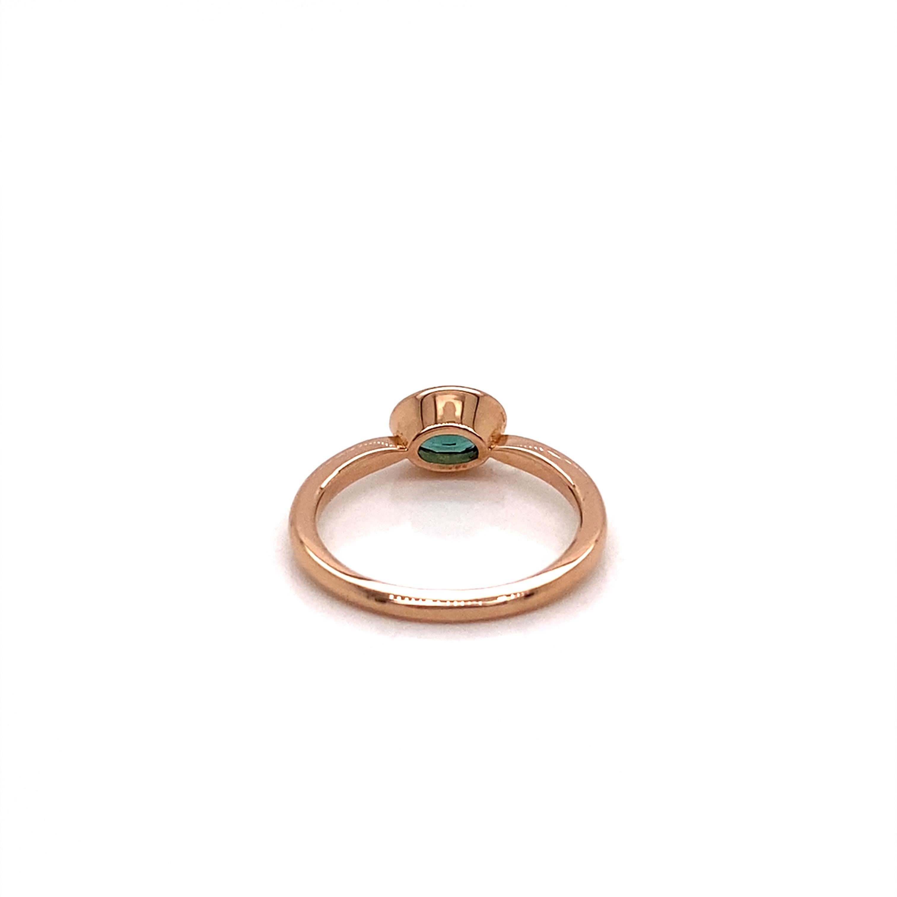 This ring features a gorgeous green oval tourmaline set in a East to West Horizontal bezel setting to create a decidedly modern and fresh aesthetic.

Perfect to be worn alone or stacked with other rings.

The Green Tourmaline was hand selected for