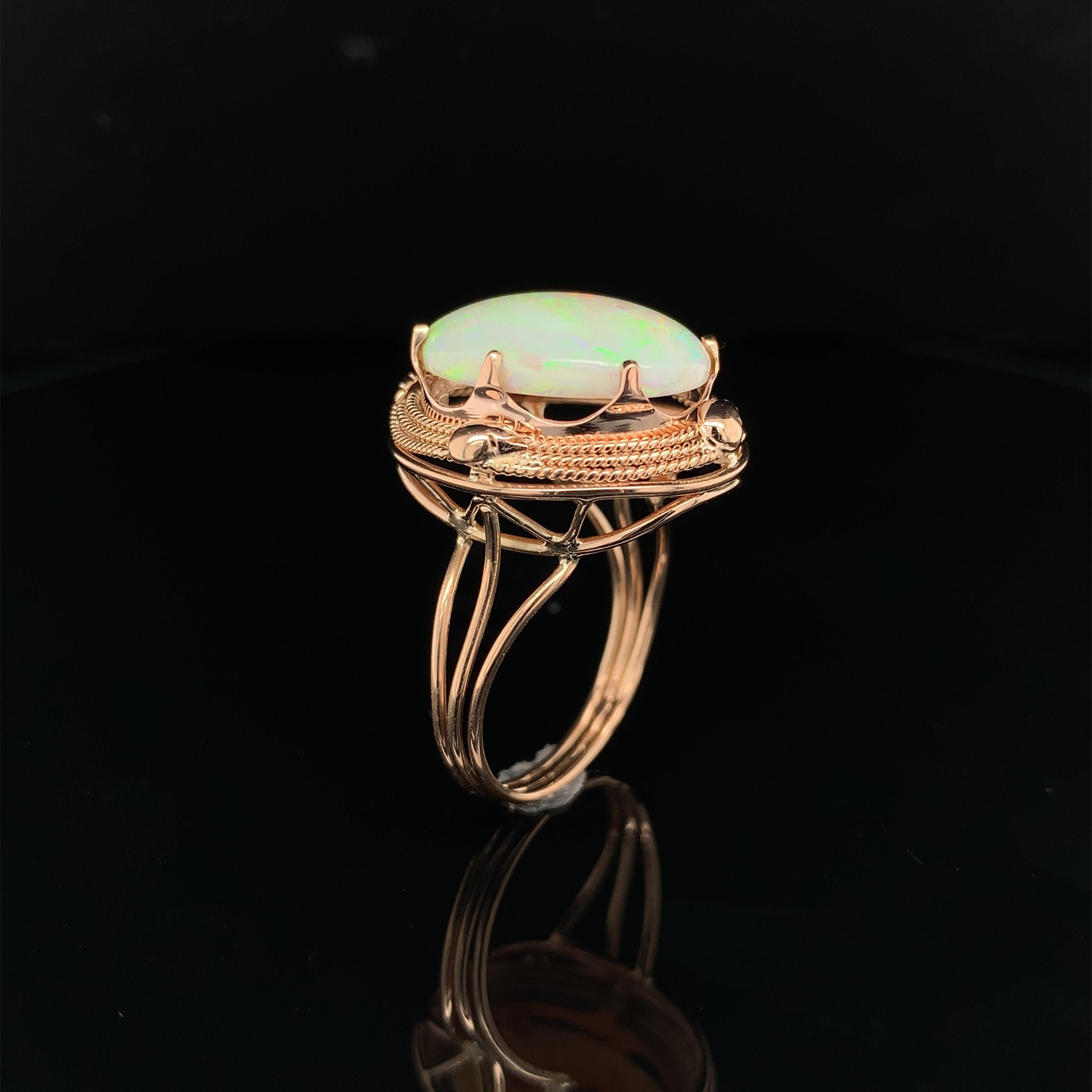 Oval Cut 14K Rose Gold Hand Wrought Ring with a large 6.05 carat Australian Opal For Sale