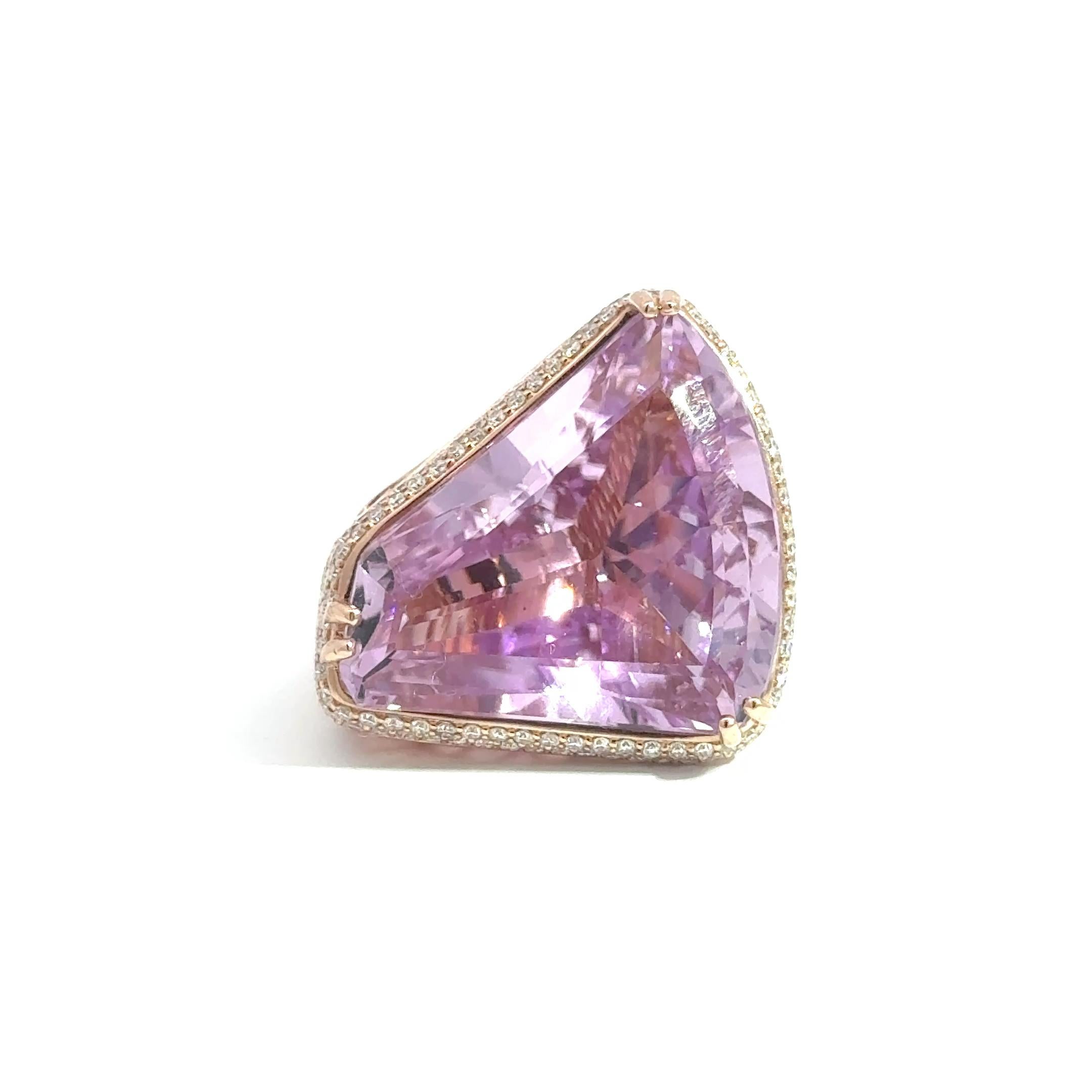 This exceptional cocktail ring is a one-of-a-kind creation designed in-house by 47th & 5th, combining bold elegance with meticulous craftsmanship. Handcrafted in 14k rose gold, the piece features a spectacular 40.11 carat natural Kunzite,