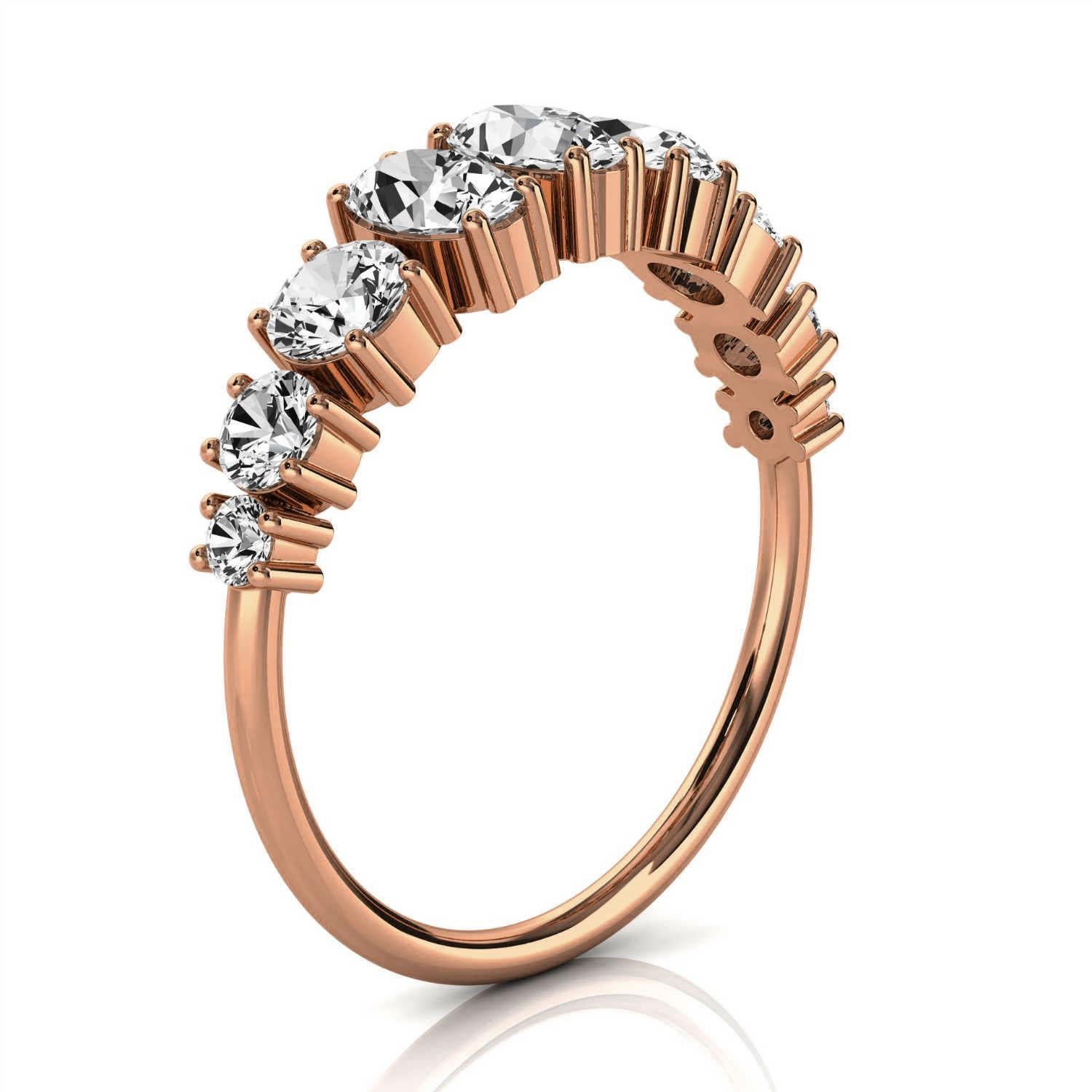 This delicate ring features three ( 3) Oval shape diamond 5x3 mm each flanked by three (3) graduated round brilliant diamonds on each side. The tiny prongs enhance its organic design. It's a conversation piece, no doubt about it. Experience the