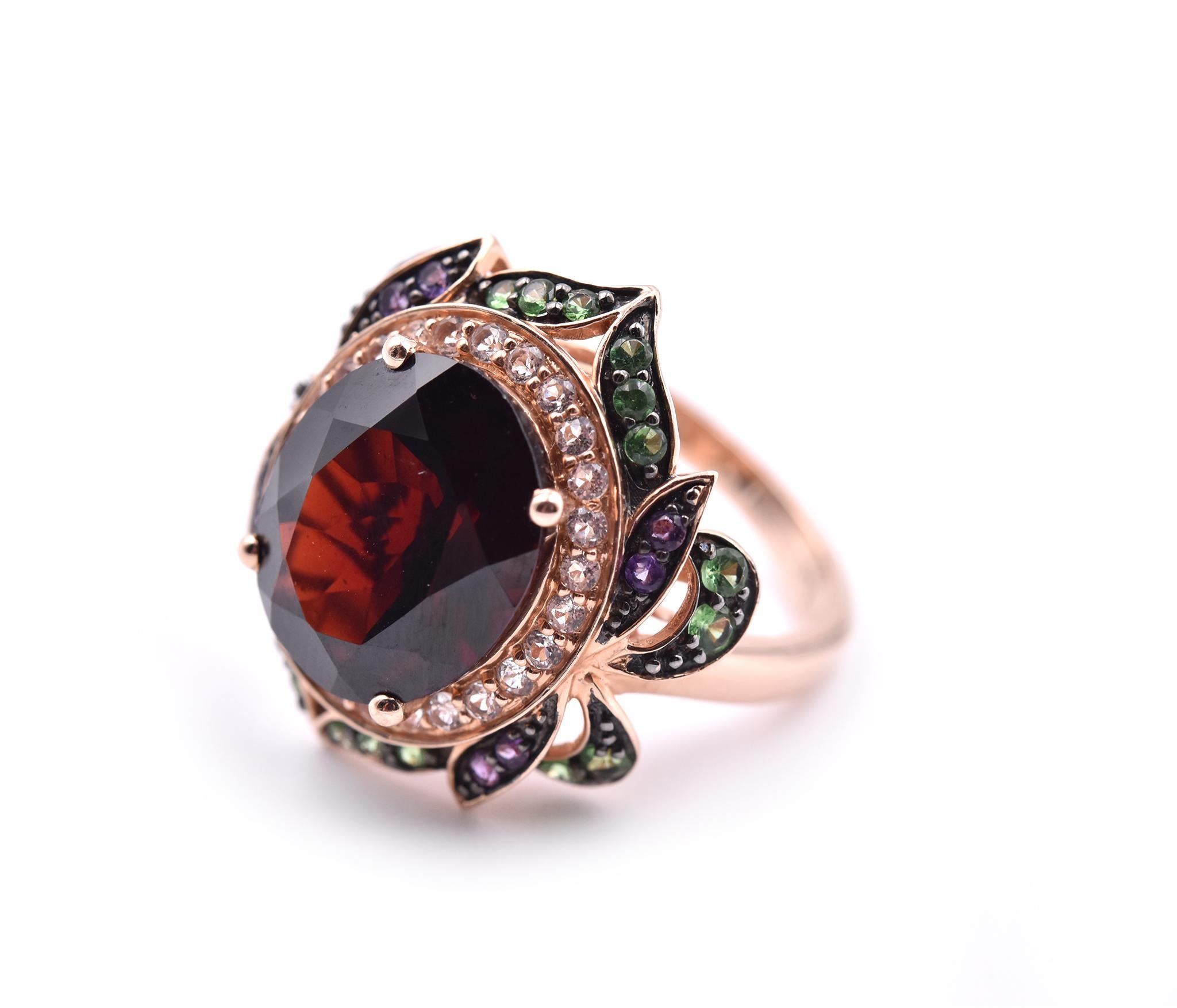 Designer: LeVian
Material: 14k rose gold 
Garnet: 1 oval cut = 10.5ct
Gemstones: tsavorite and vanilla topaz
Dimensions: ring measures 28.19mm in height and 21.18mm in width
Weight: 8.09 grams
