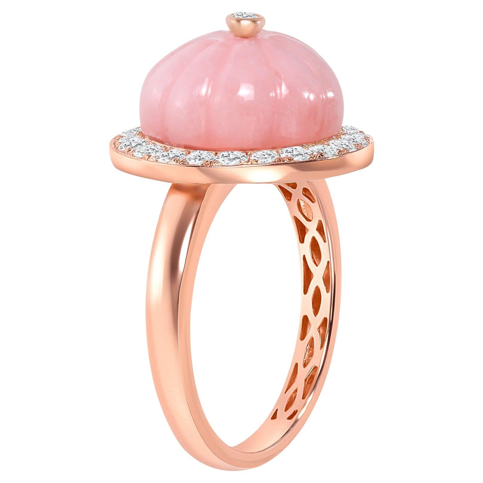 Step into sophistication with this unique ring, meticulously fashioned in luxurious 14k gold, showcasing a mesmerizing pink opal encircled by shimmering diamonds. Its exquisite design exudes elegance and style, making it the perfect complement to