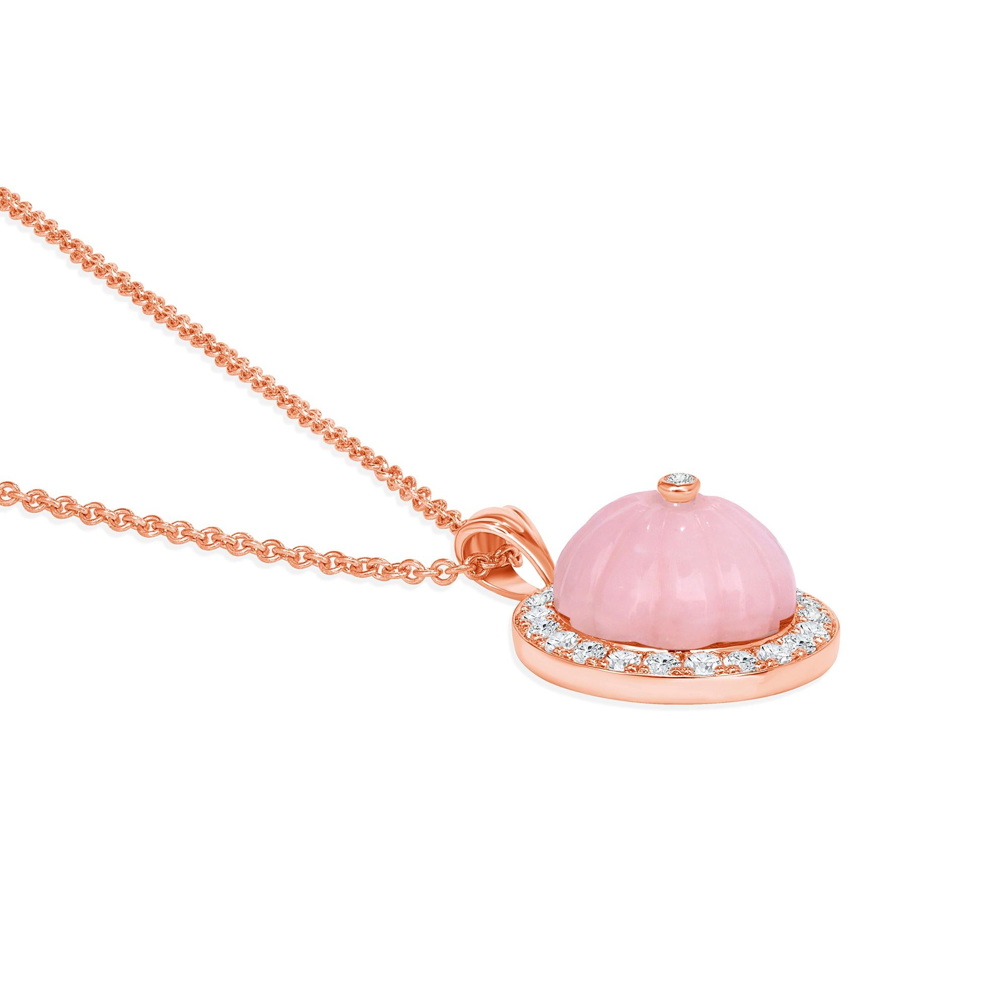 Indulge in the timeless allure of this pendant, expertly crafted in 14k gold and adorned with captivating pink opal and sparkling diamonds. Radiating elegance and charm, this pendant complements any outfit, seamlessly transitioning from day to night