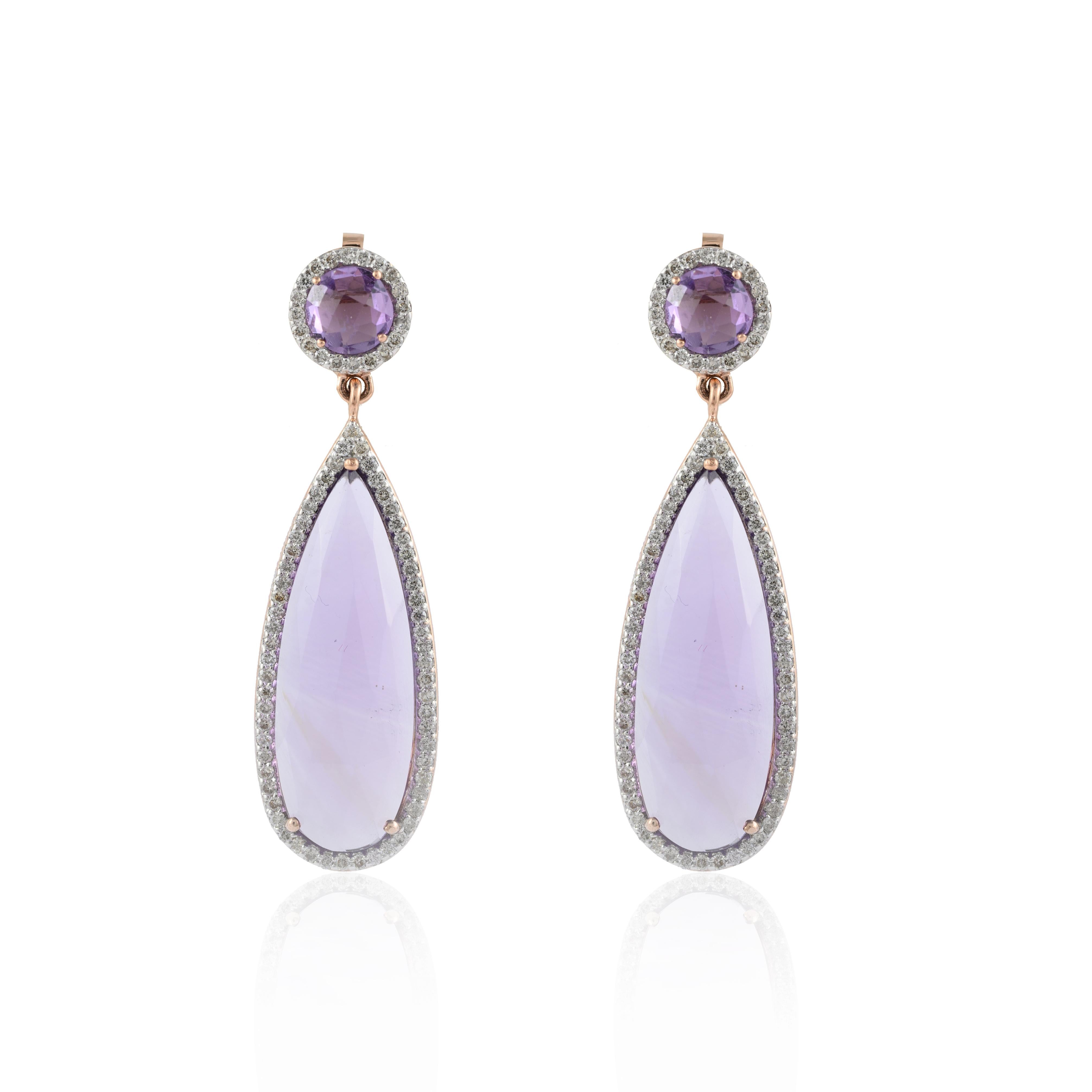 Diamond Amethyst Dangle Drop Earrings in 14K gold to make a statement with your look. These earrings create a sparkling, luxurious look featuring pear and round cut amethyst.
Amethyst has a highly calming energy wearing this gem provides