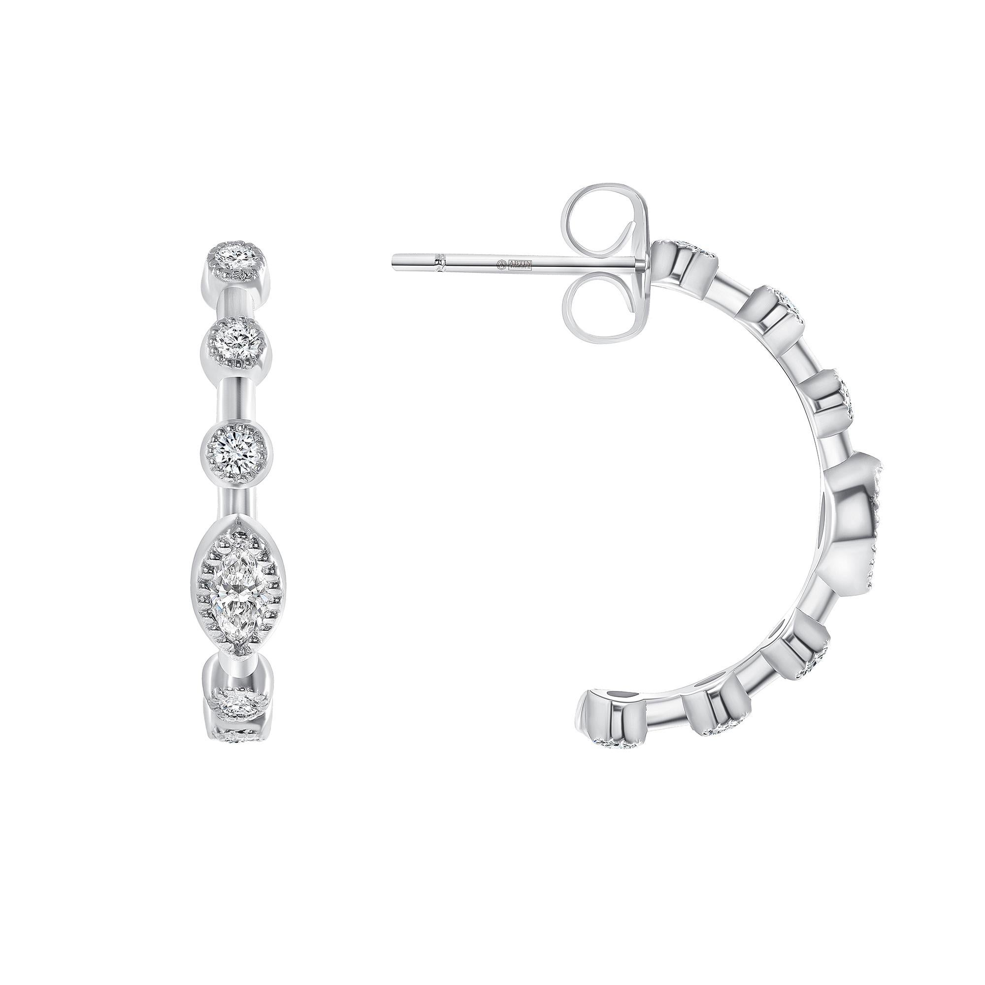  Enhance your style with this eye-catching hoop earring adorned with dazzling marquise diamonds complemented by glossy bezel-set round diamonds in elegant 14K gold.
Gold Weight: 2.00 gr.
Diamond Weight: 0.40 ct
Available in white, yellow, and rose