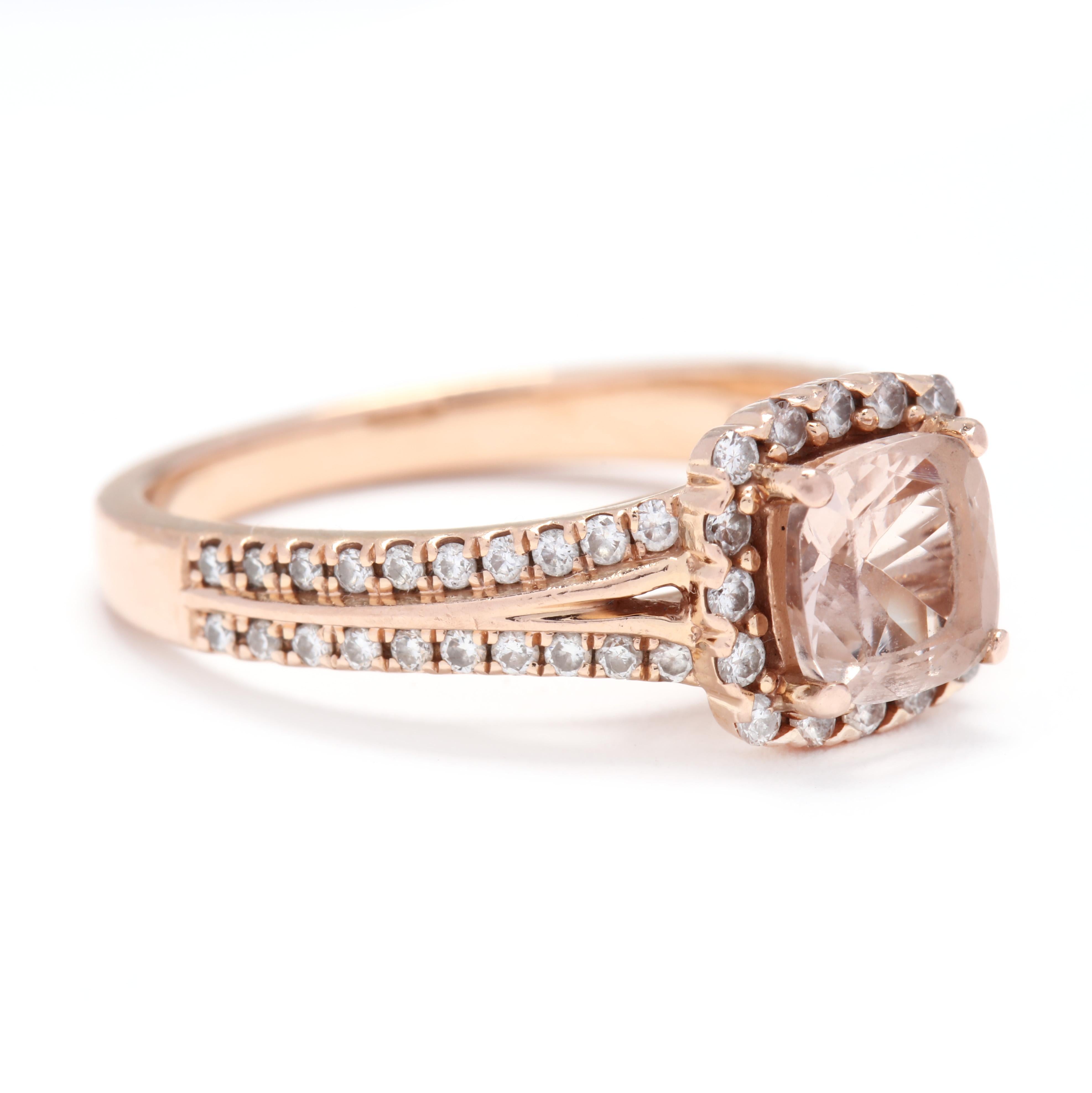 14k rose gold morganite and diamond halo ring. A classic halo ring with a cushion-cut Morganite weighing 0.60 carats in the center. The band has two rows of diamonds that weigh approximately 0.36 carats total. The rose gold is a lovely complement to