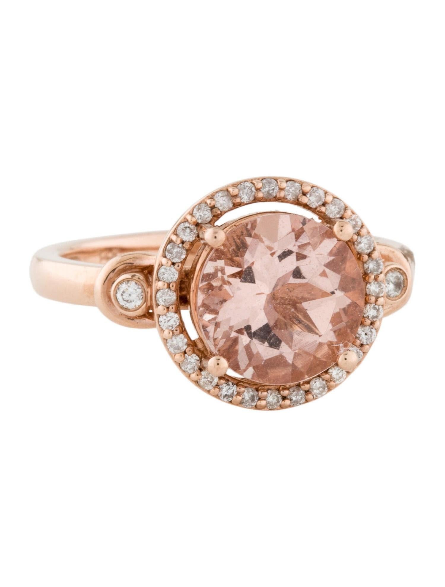 This stunning natural morganite and diamond-encrusted ring is set in solid 14K rose gold. The natural round cut 2.55 carat morganite has an excellent peachy pink color and is surrounded by a halo of round cut white diamonds. The ring is stamped 14K