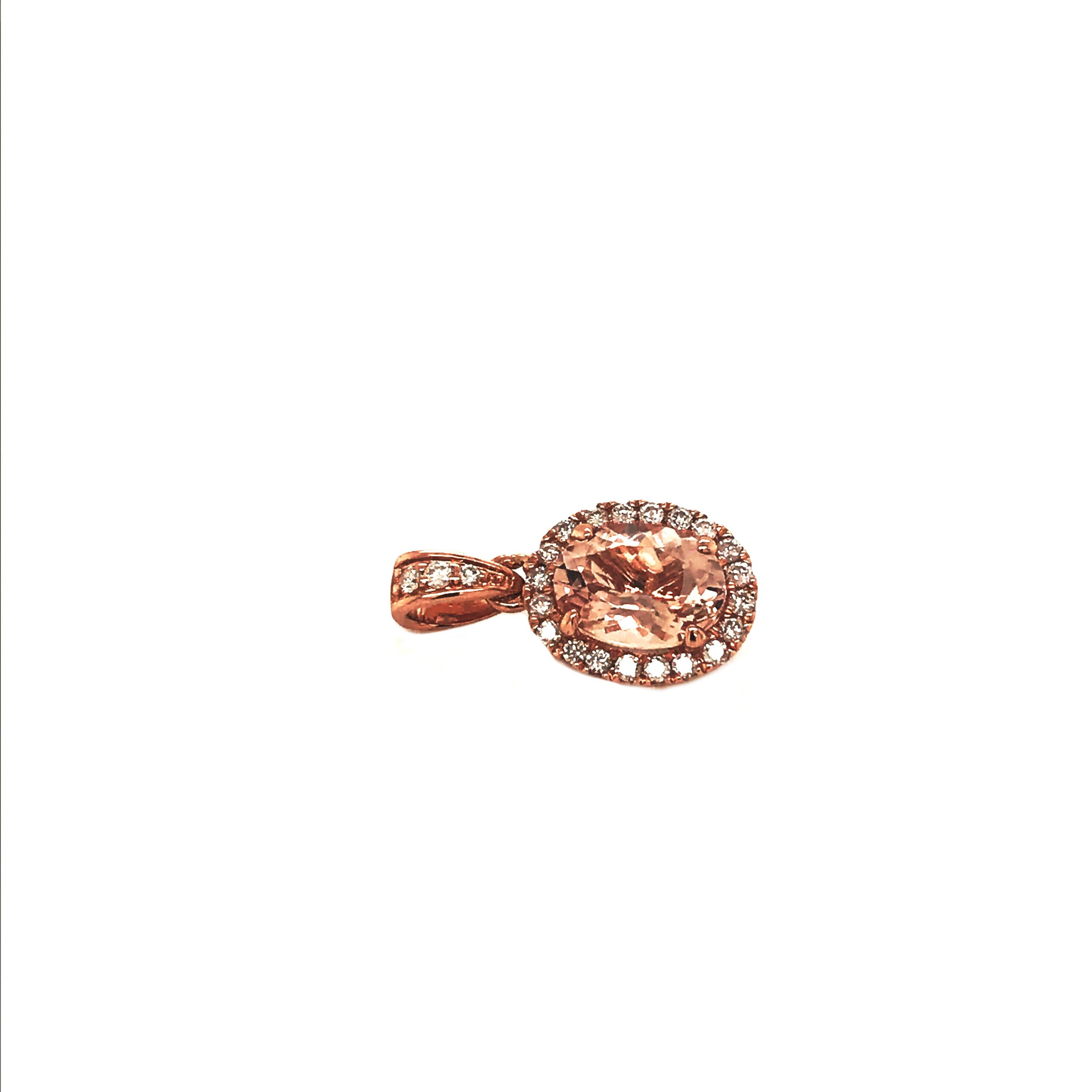 This is a gorgeous natural morganite and diamond pendant set in solid 14K rose gold. The fancy 8x6MM oval morganite has an excellent peachy pink color and is surrounded by a halo of round-cut white diamonds. The ring is stamped 14K and is a true