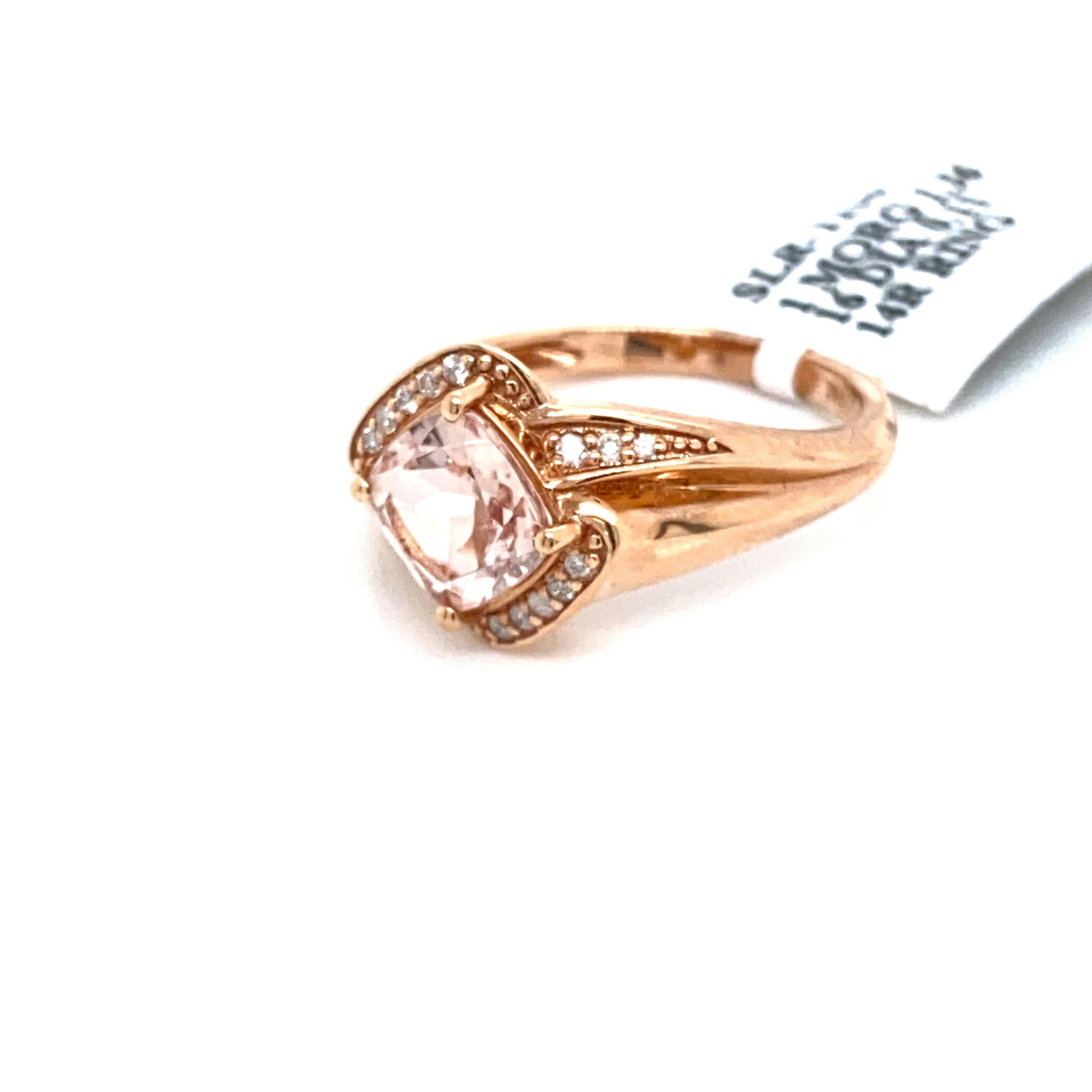 This stunning and antique natural morganite and diamond ring set is in solid 14K rose gold. The natural 1.36 Ct Cushion cut morganite has an excellent peachy pink color and is surrounded by alternating stripes of round cut white diamonds. The ring