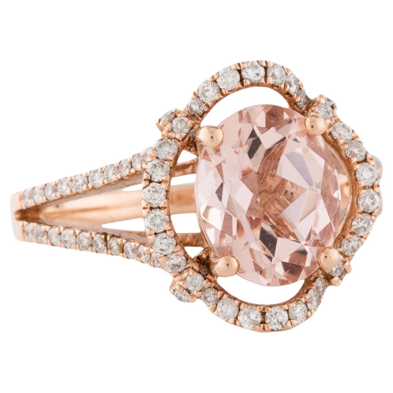 This is an alluring natural morganite and diamond ring set in solid 14K rose gold. The natural 2.37 Ct oval cut morganite has an excellent peachy pink color and is surrounded by a halo of round cut white diamonds. The ring is stamped 14K and is a