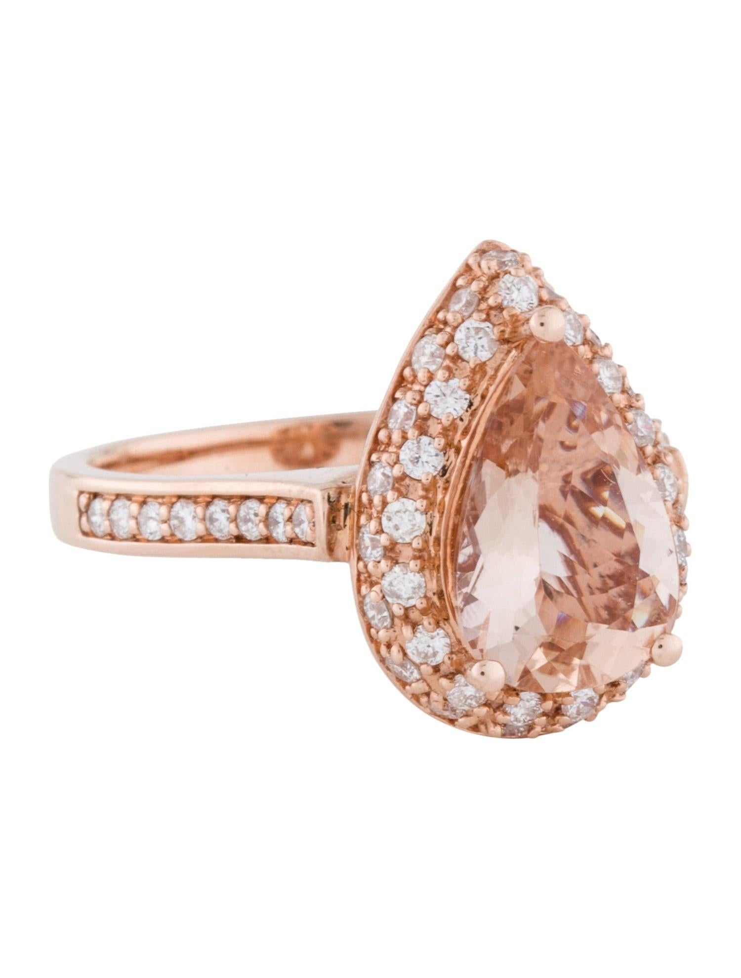 This flawless natural morganite and diamond ring is set in solid 14K rose gold is a true showstopper. This ring has a natural 2.38Ct pear cut morganite stone with excellent peachy pink color and is surrounded by a halo of round cut white diamonds.