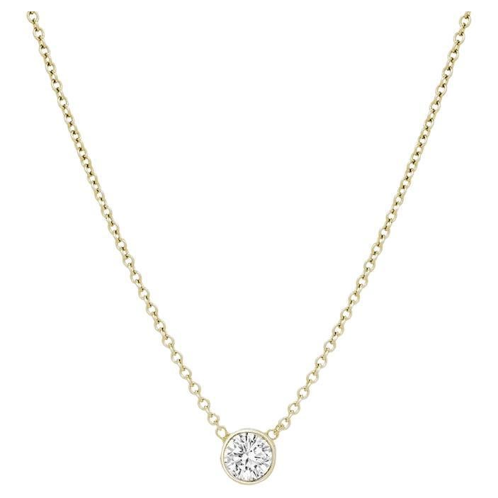 This diamond necklace features an elegant round diamond in 14k gold.

Gold: 14k
Setting: Bezel
Clasp: Lobster Claw Clasp
Color: Rose Gold
Diamond Cut: Round
Diamond Color: F-G
Diamond Clarity: VS-SI 
Necklace Length: 16 Inch 
Carat Weight: 0.50