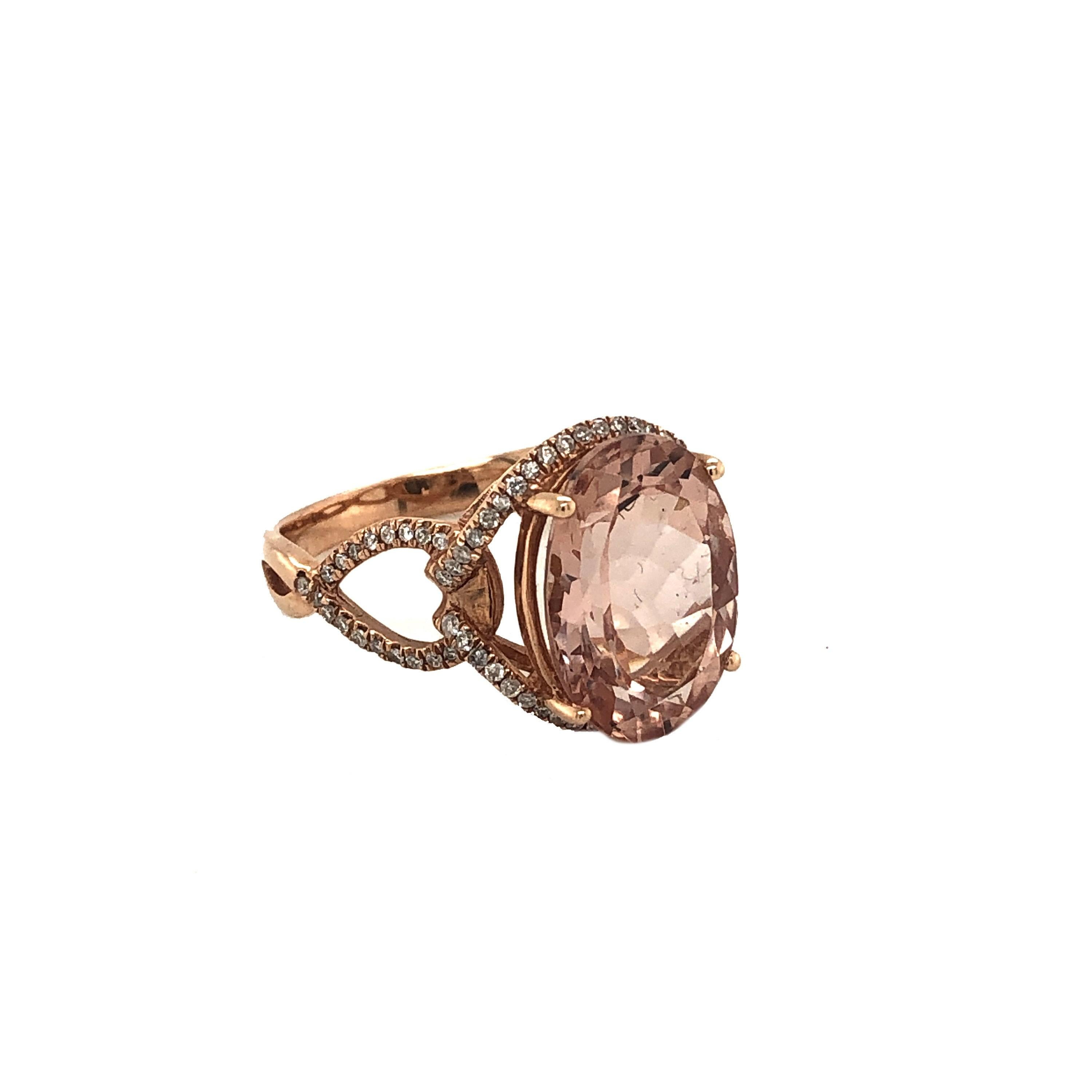This featured item is a gorgeous natural 5.19CT morganite and diamond halo ring set in solid 14K rose gold. The natural 14x10MM Oval cut 5.19 carat morganite stone has a vibrant pinky peach color and is accented by a halo of round-cut white