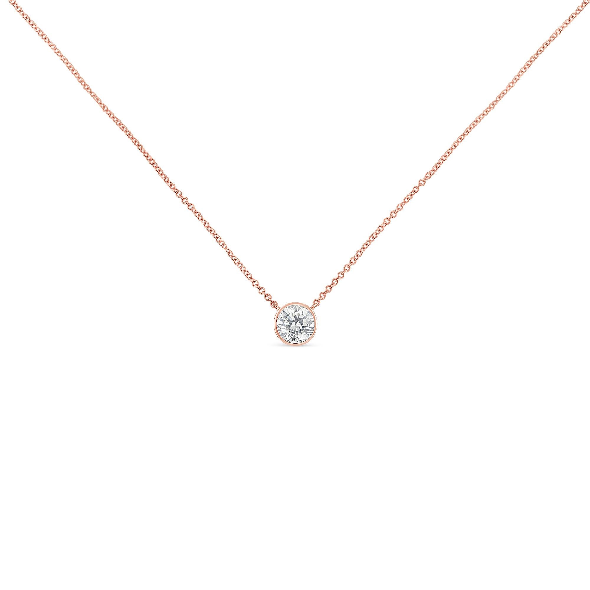 A twinkling 1/3ct round diamond rests in a soft bezel setting. Anchored on each side, a cable chain holds the pendant in place. This 14k rose plated sterling silver necklace is the perfect option for everyday wear. This beautiful necklace includes