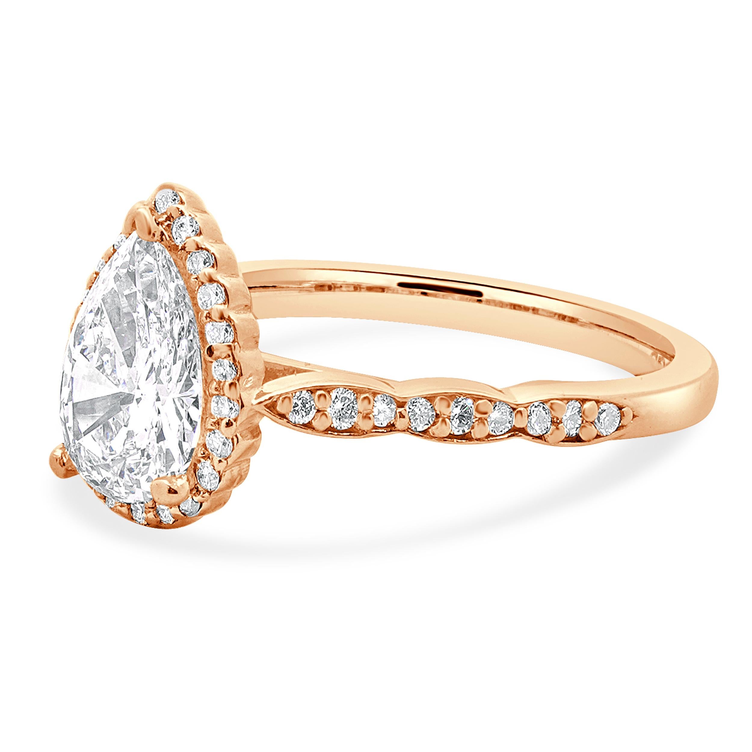 Designer: custom
Material: 14K rose gold
Diamond: 1 pear cut = 1.07ct
Color: H
Clarity: VS2
Diamond: 38 round brilliant = 0.38cttw
Color: H
Clarity: SI1
Ring Size: 5.0 (complimentary sizing available)
Weight: 2.99 grams
