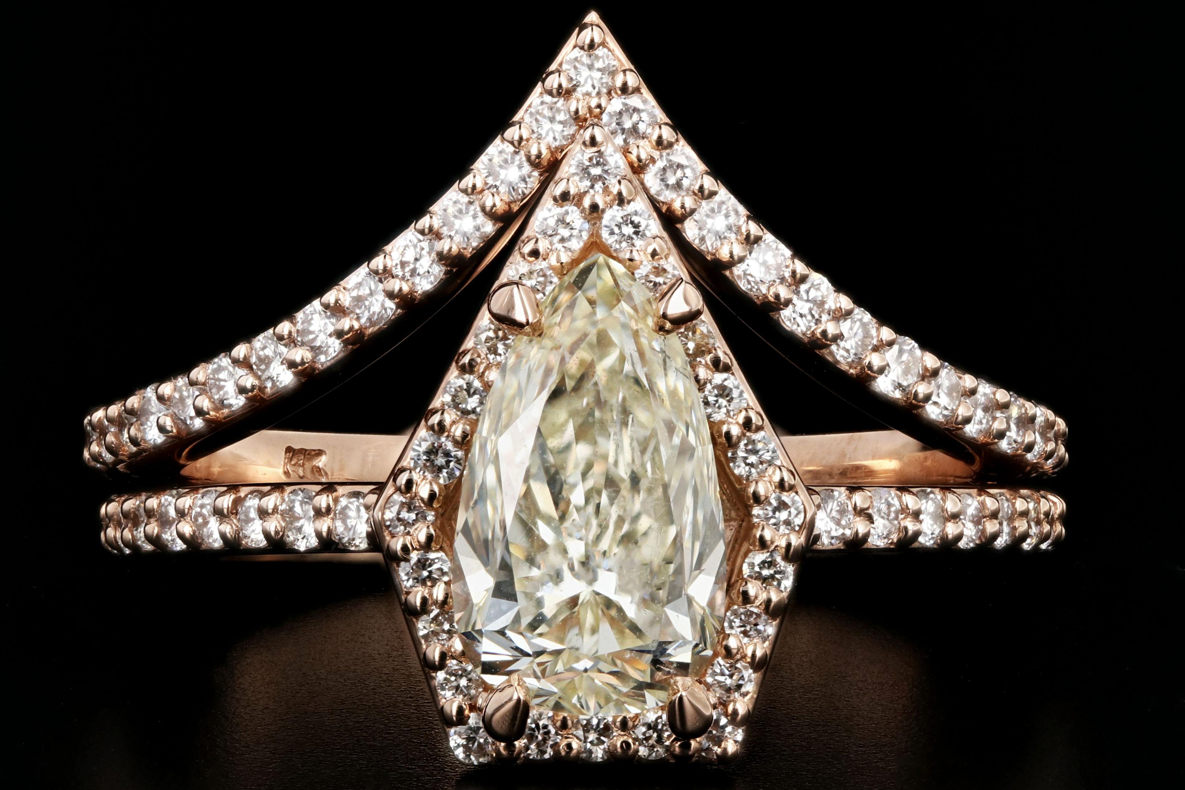 Era: New

Composition: 14K Rose Gold

Primary Stone: Pear Shaped Diamond

Stone Carat: 1.56 carats

Color / Clarity: N/ SI2

GIA Certification Number: 1206131926

Accent Stone:  Round Brilliant Cut Diamonds

Color/Clarity: I/J- SI1/2

Accent Diamond