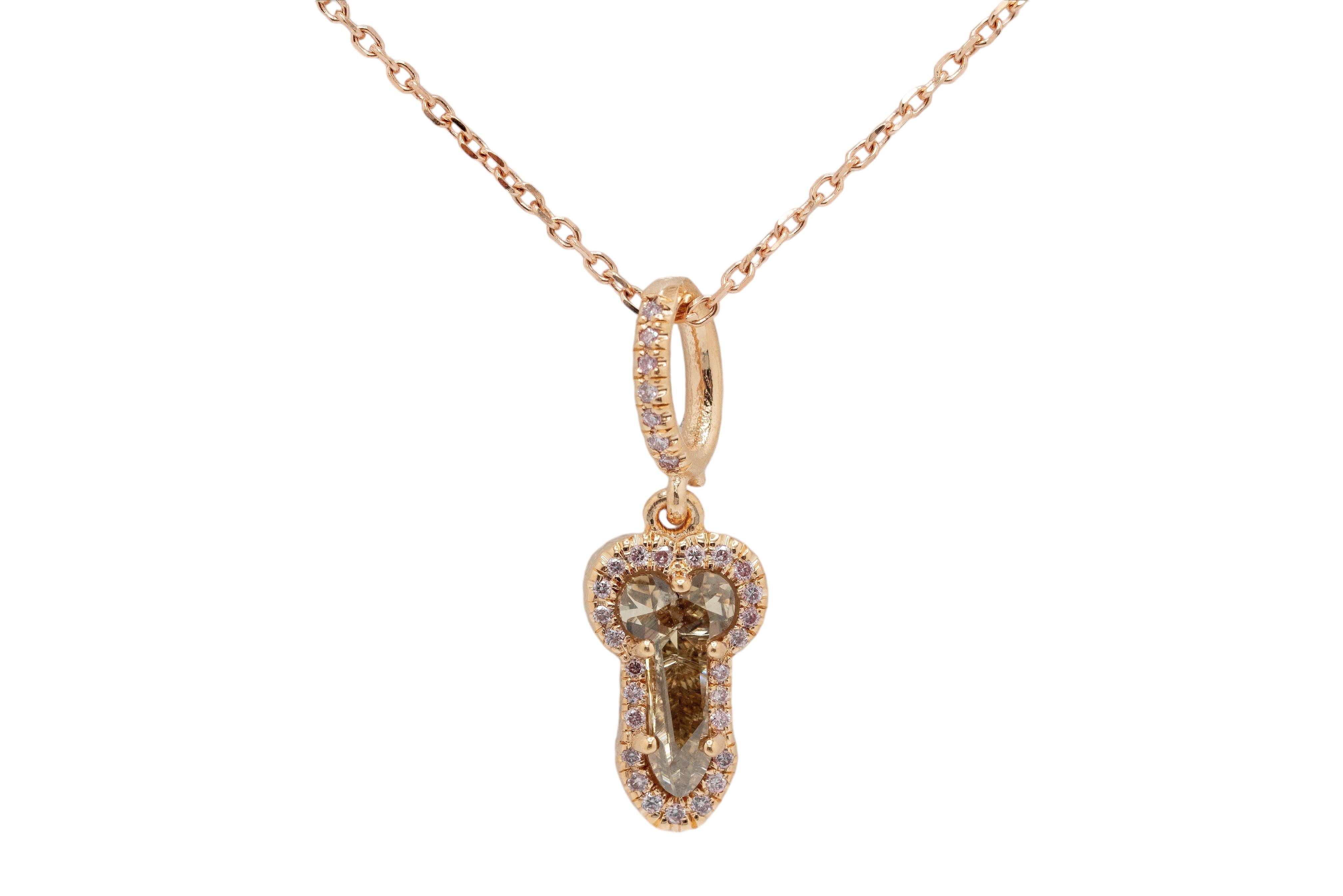 This unique 14K Rose Gold Phallic Necklace features a one-of-a-kind Natural Fancy Pink Pendant with a playful and bold design. Set with a 0.83-carat natural brown diamond, this piece combines elegance with a sense of individuality. The pendant hangs