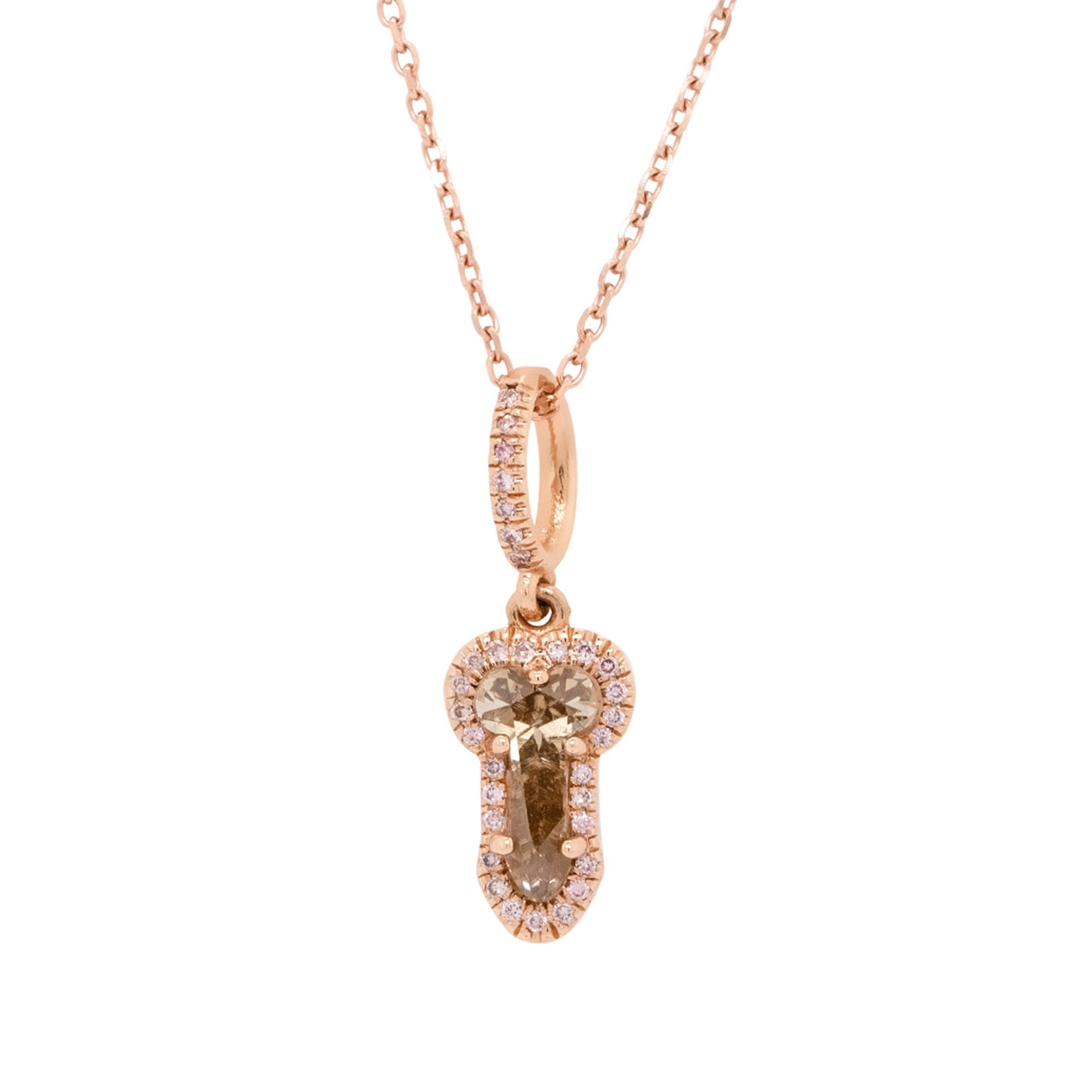 This unique 14K Rose Gold Phallic Necklace features a one-of-a-kind Natural Fancy Pink Pendant with a playful and bold design. Set with a 0.83-carat natural brown diamond, this piece combines elegance with a sense of individuality. The pendant hangs