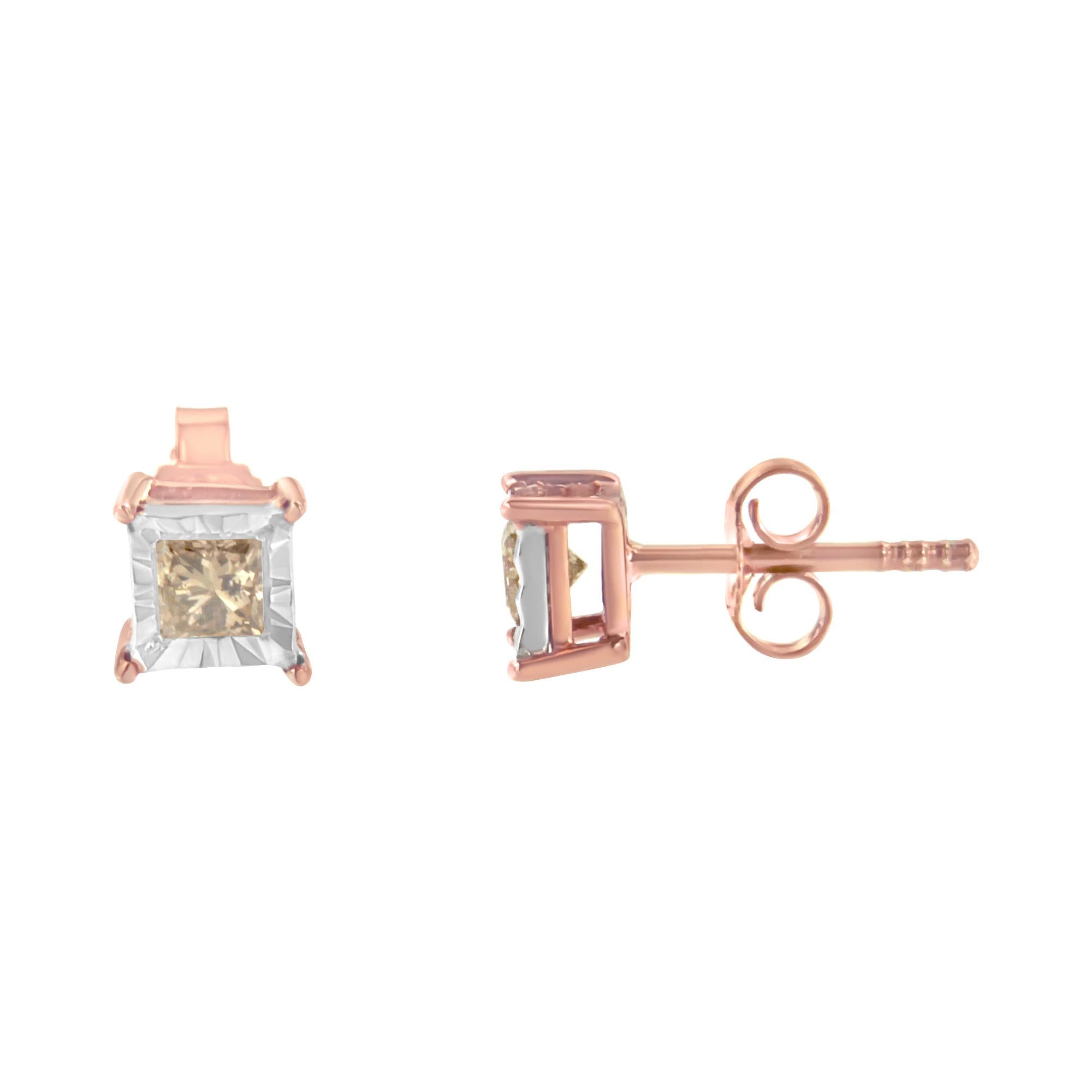 This charming pair of diamond studs features miracle set princess cut diamonds. The unique design is crafted in 2 micron plated rose gold plated sterling silver making them the perfect accessory to add sparkle to any outfit. The total diamond weight