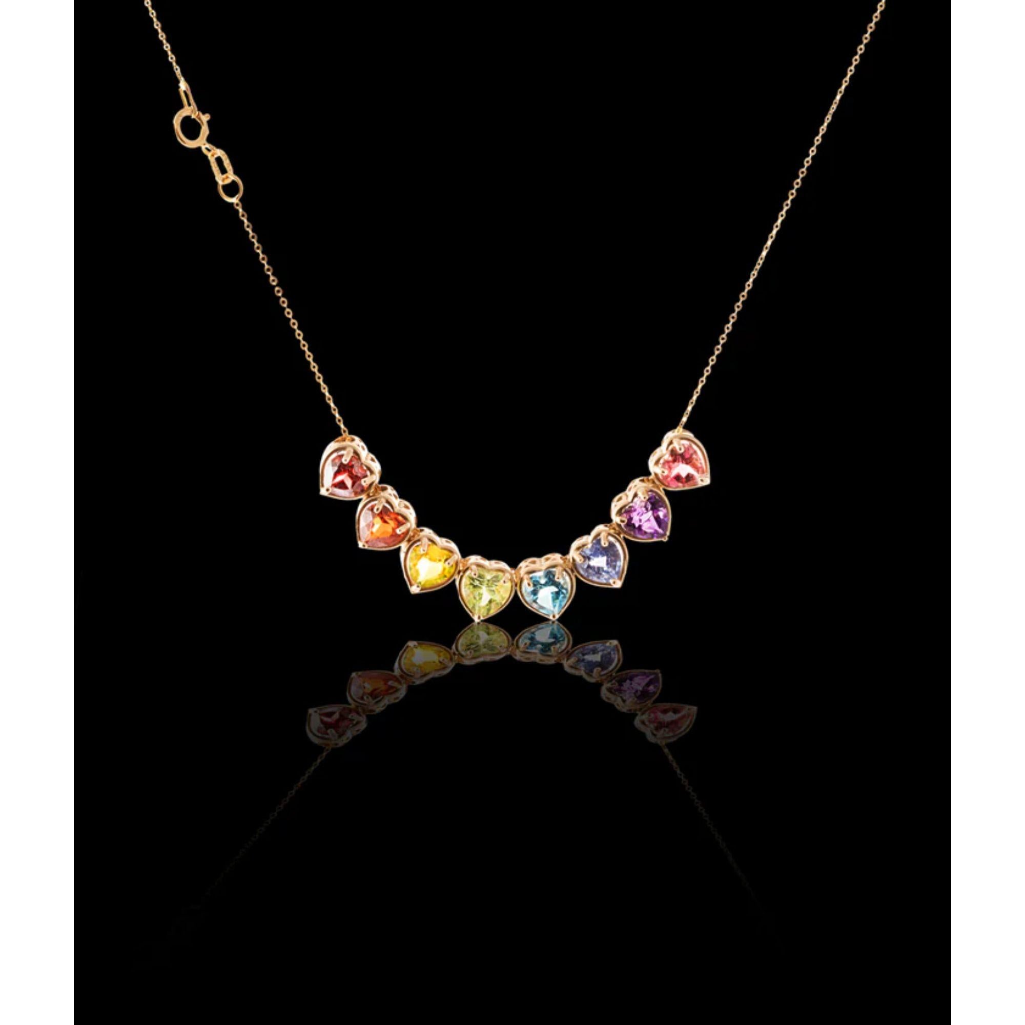 The full rainbow fantasy in the most unique and colorful slider, pendant necklace to light up your neck. This slider necklace is like no other and consists of heart settings with precious gems and sapphires in the Classic Mordekai rainbow pattern.