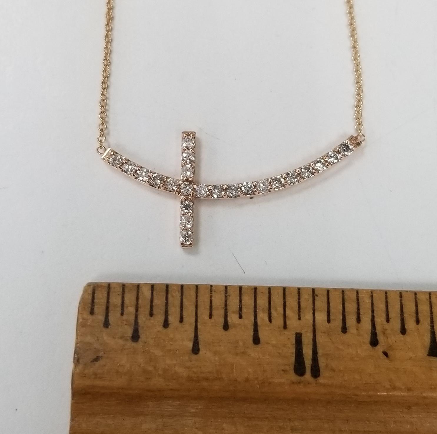Round Cut 14k Rose Gold Resting Diamond Cross Weighing .40pts For Sale
