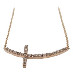 14k Rose Gold Resting Diamond Cross Weighing .40pts