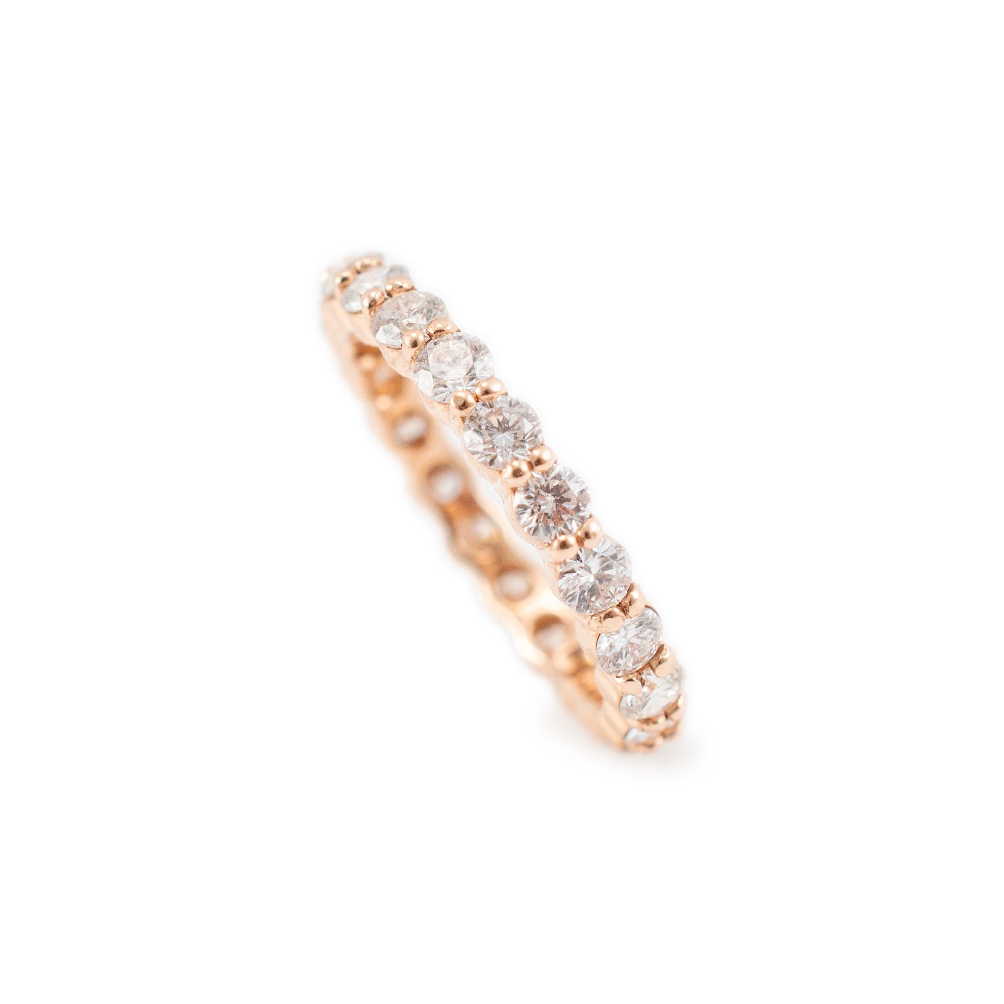 Gender: Ladies

Metal Type: 14K Rose Gold

Size: 6.5

Width: 2.90 mm

Weight: 2.80 Grams

One ladies custom made polished 14K rose gold, diamond eternity, wedding band with a half-round shank. The metal was tested and determined to be 14K rose gold.