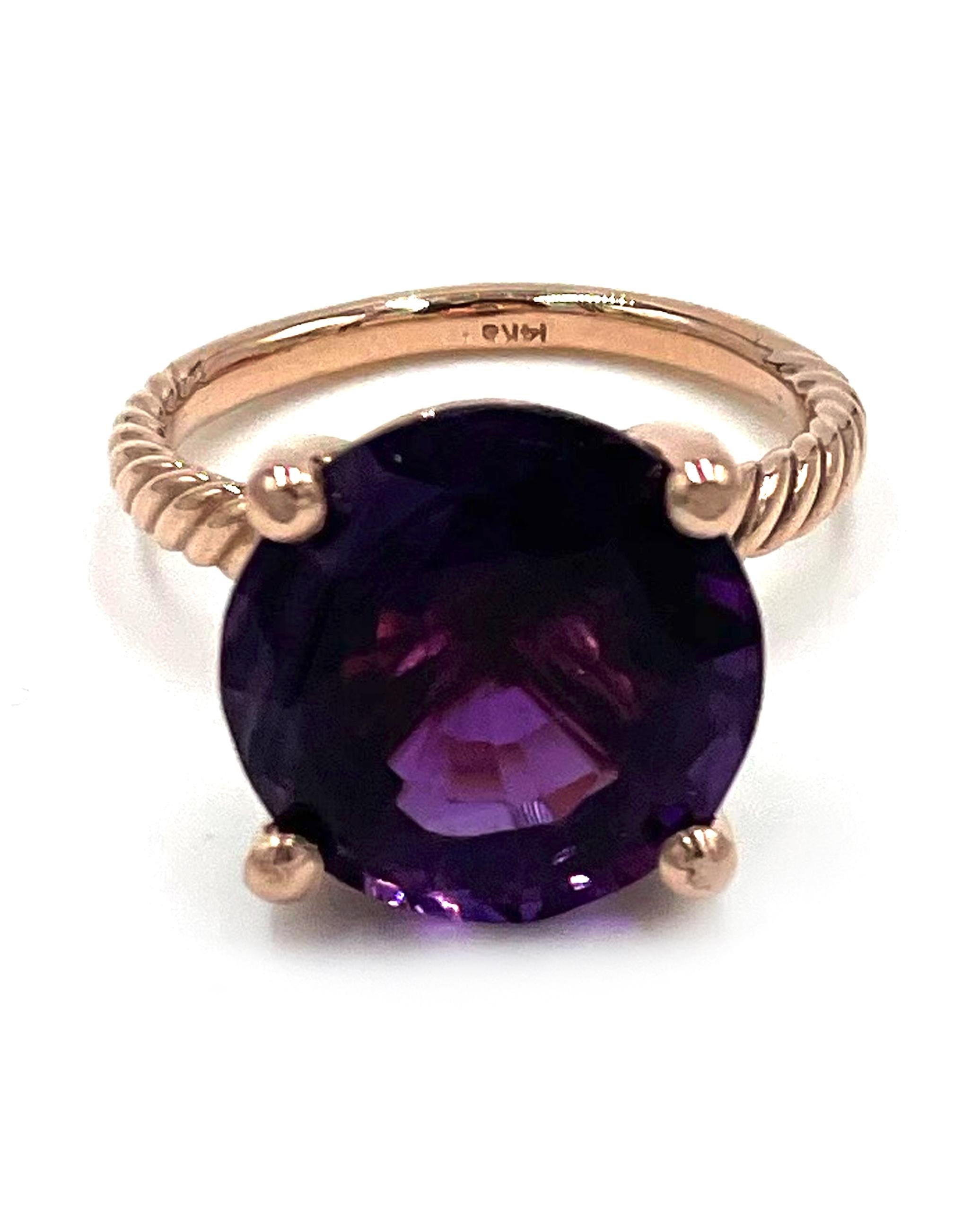 14K rose gold rope style solitaire ring set in four prongs with one round faceted amethyst weighing 10.00 carats.

* Amethyst dimensions: Approximately 14.00x14.07mm
* Shank width is 2.5mm and tapers down to 2mm
* Finger size 7 (can be sized)