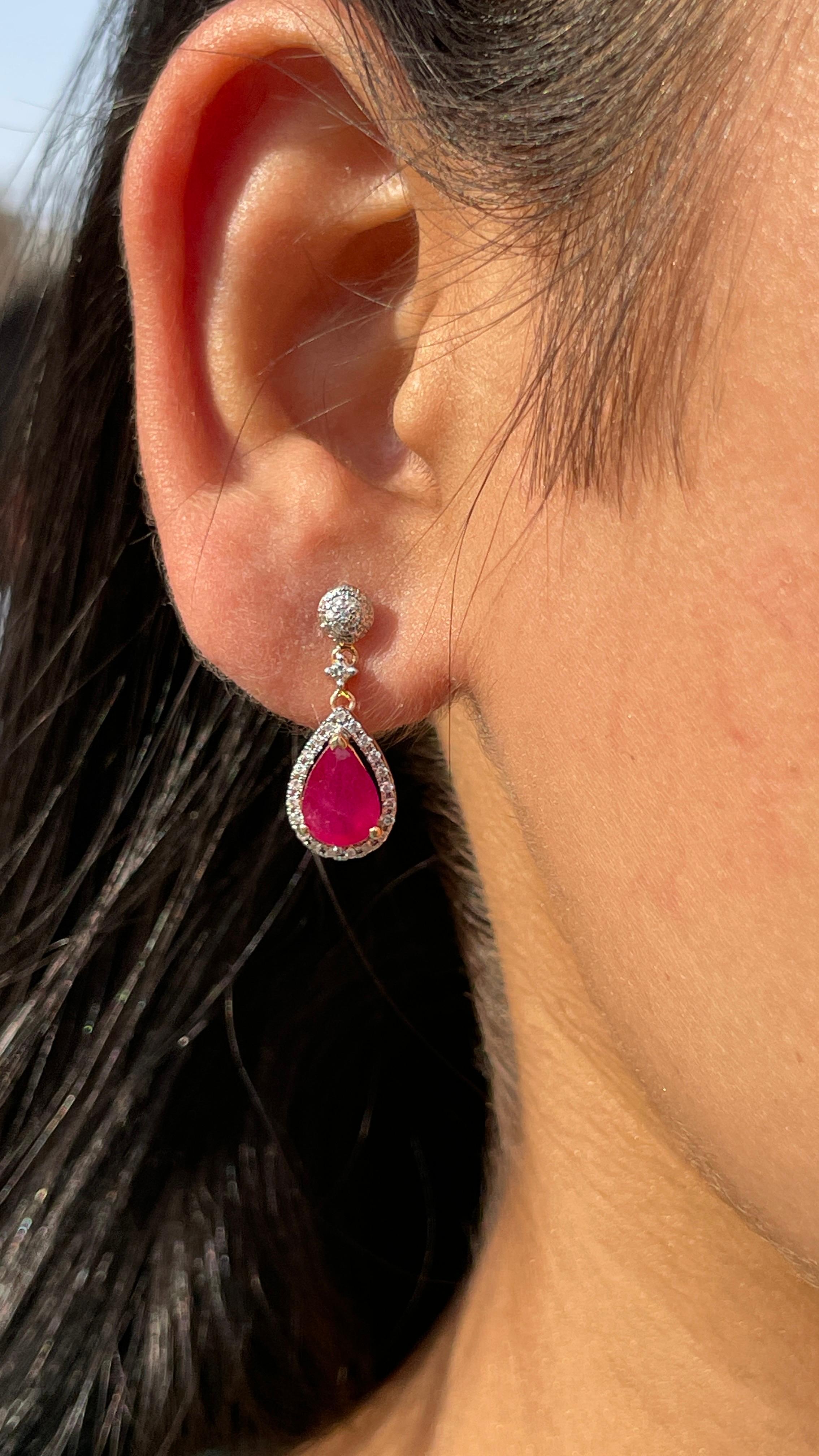 Ruby Drop and Dangle earrings with diamonds to make a statement with your look. These earrings create a sparkling, luxurious look featuring pear cut gemstone.
If you love to gravitate towards unique styles, this piece of jewelry is perfect for