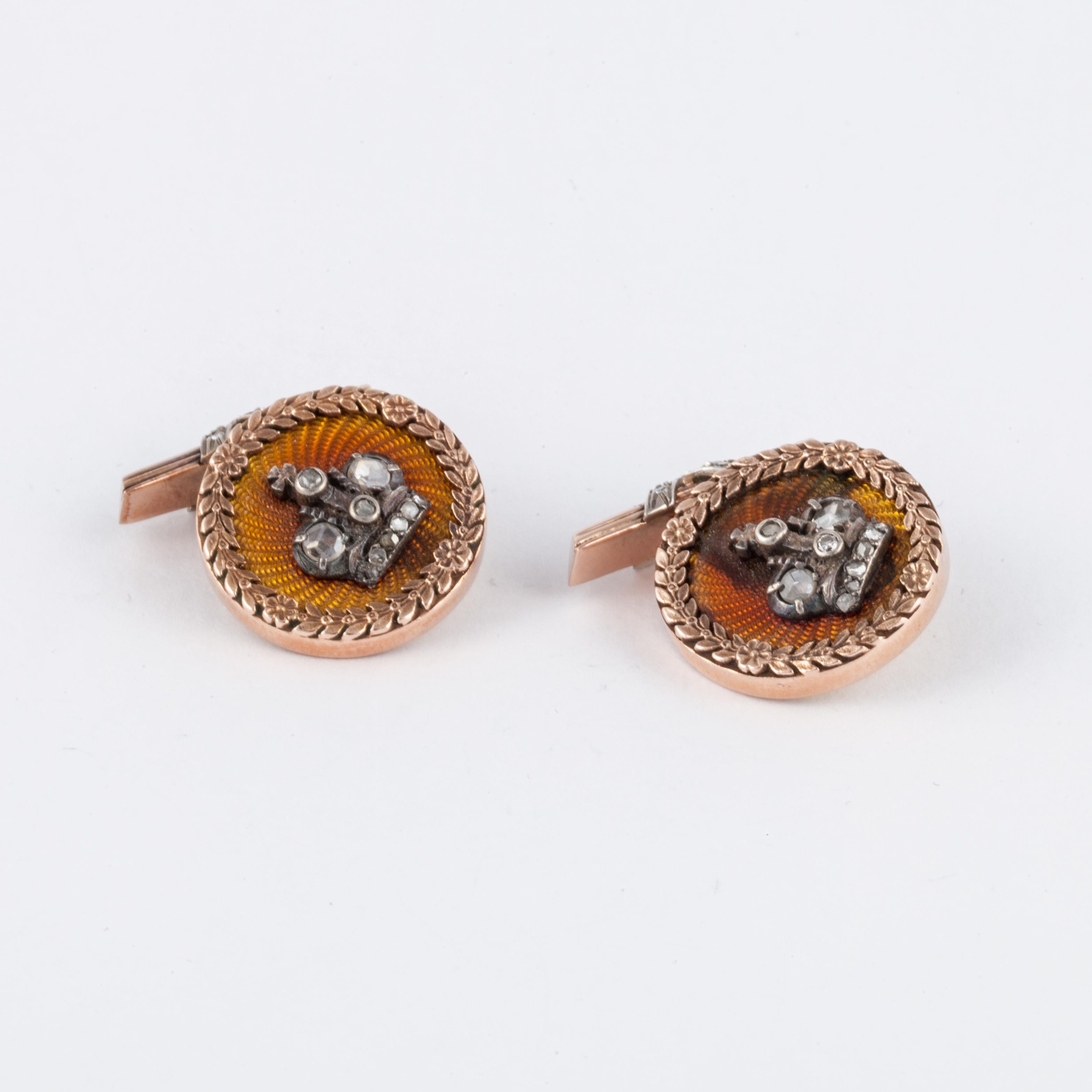 14K rose gold cufflinks with Russian hallmarks.  The background is a golden enamel with a crown on top accented with diamonds.  There are a total of 19 diamonds weighing 0.46 carats.  Measure 3/4 inches in diameter. 