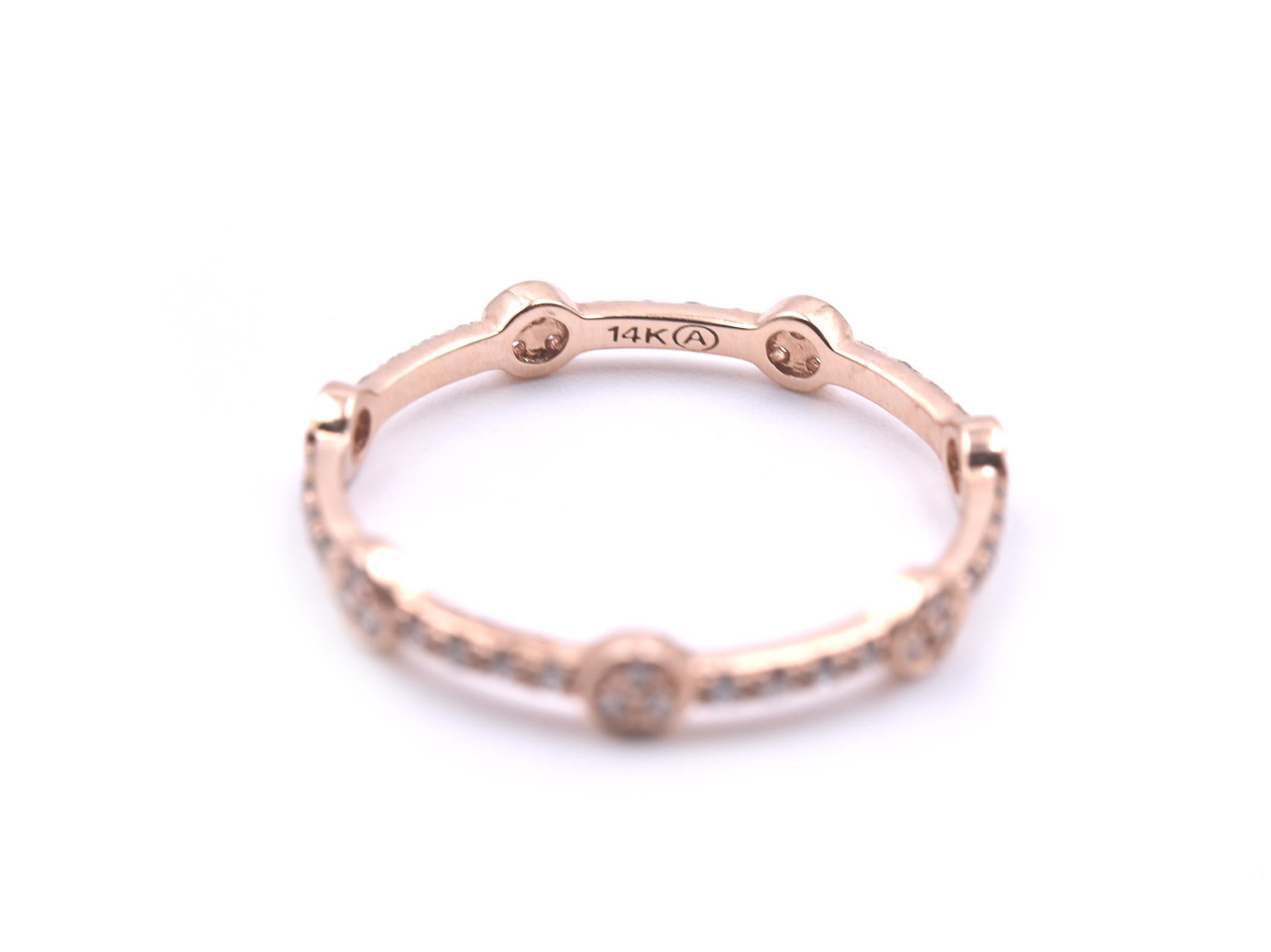 Designer: custom design
Material: 14k rose gold
Diamonds: 49 round brilliant cut = .25cttw
Color: G
Clarity: VS
Ring size: 7 ¼ 
Weight: 1.20 grams 

