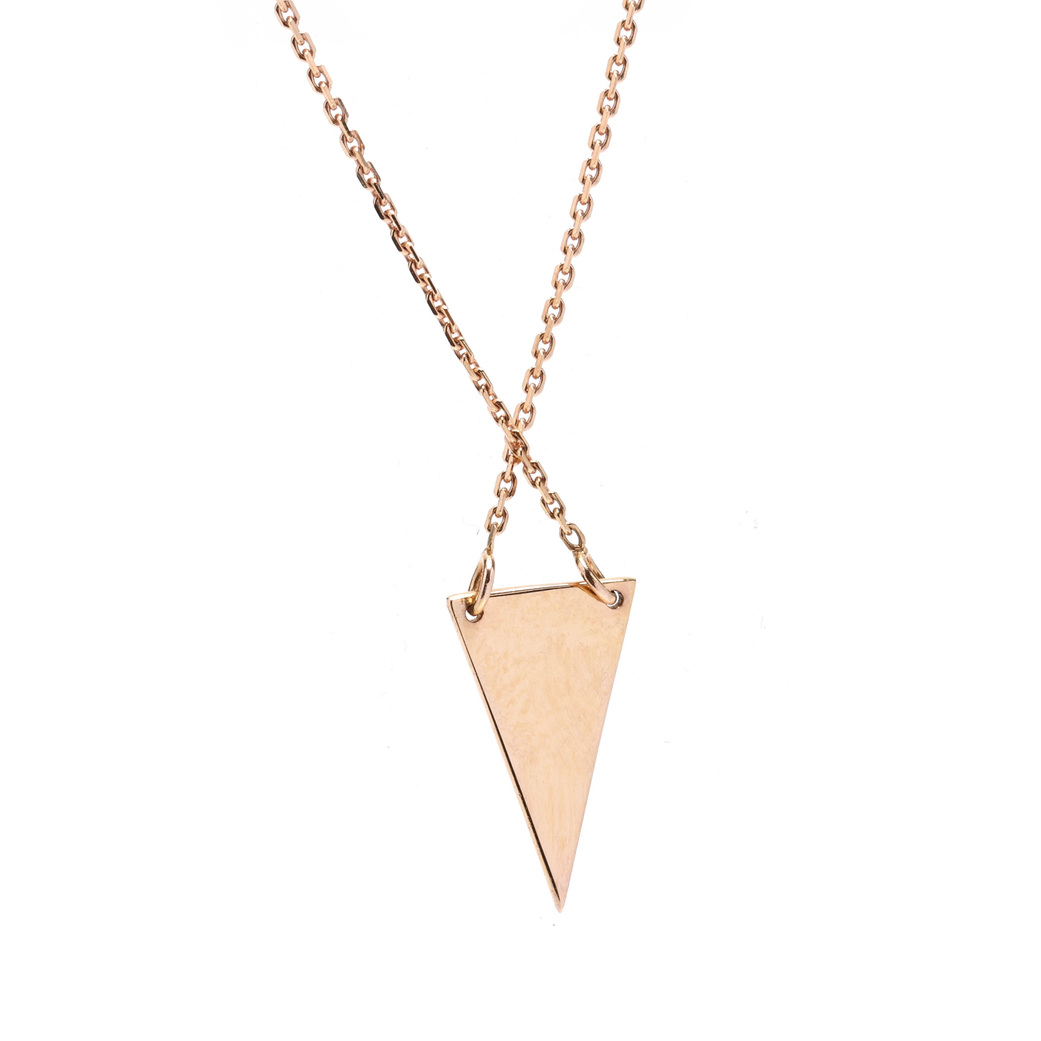 This delicate and dainty 14K rose gold triangle necklace is a minimalist yet stylish accessory. Measuring 16-18 inches in length, this pendant necklace is versatile and can be adjusted to suit your desired length. Crafted in 14K rose gold, this