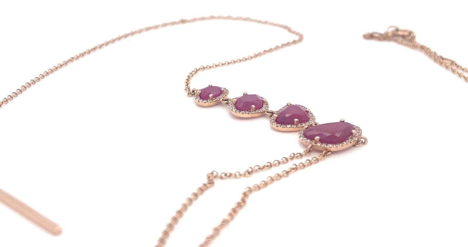 Features Faceted Asymmetrical Rubies accented with Diamond Bezels
Set in 14k Rose Gold
Gross Weight: 4.70 grams
Length of Four Ruby Stations = 1.5