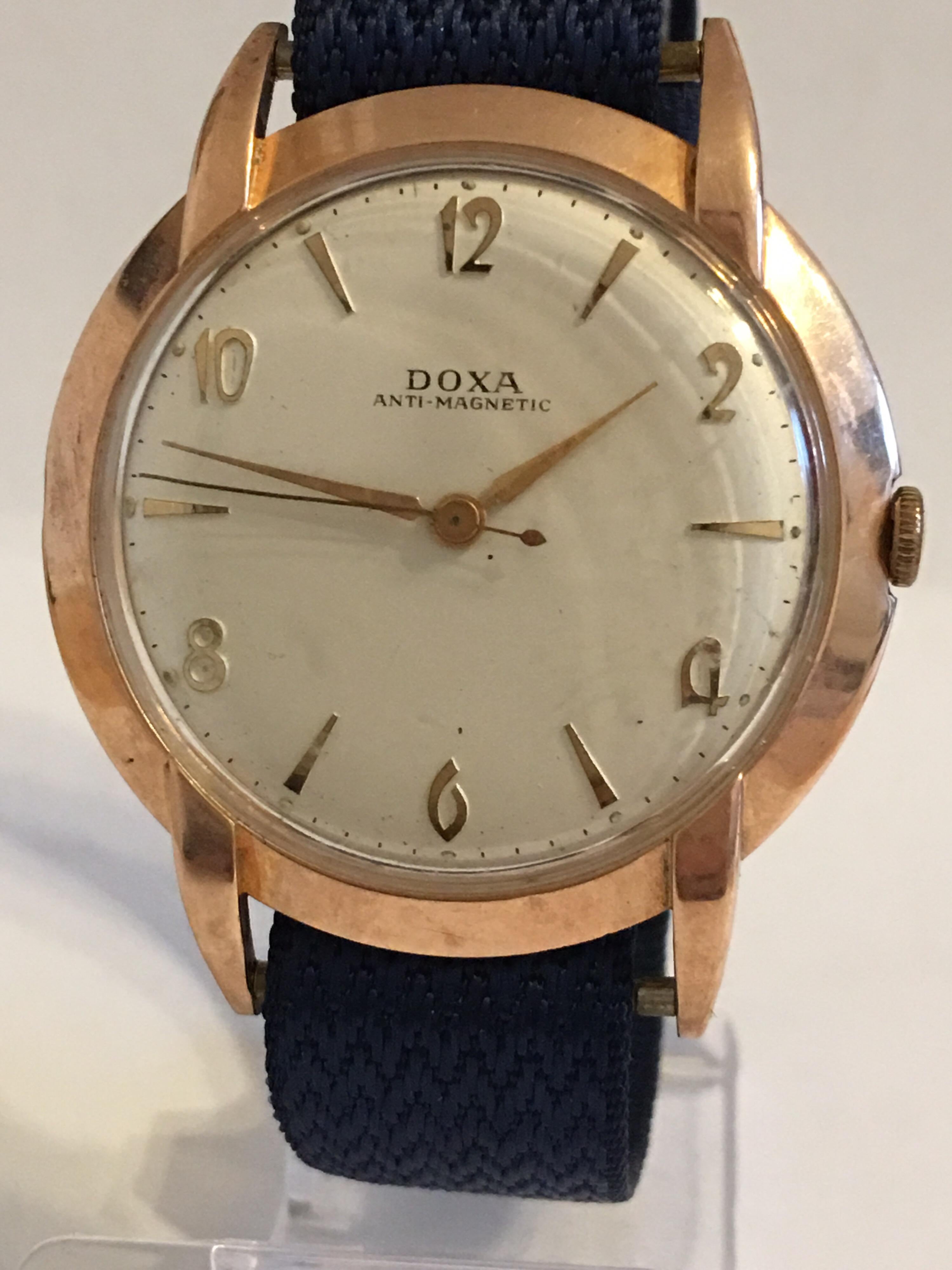 This Vintage mechanical 14K Gold watch is in good Working condition and is ticking well. Visible scratches and dents on the back watch case as shown
The cloth material strap is a bit worn and the strap buckle is silver plated Please study the images