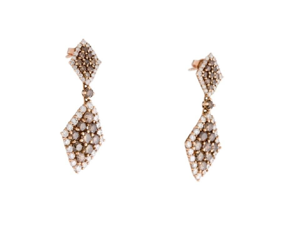 This are dazzling chocolate and white diamond earrings stamped in 14K rose gold. The dainty and striking chocolate diamonds have a fabulous champagne/brown color along with the sparkling white diamonds. This is a timeless piece and one of Amy's
