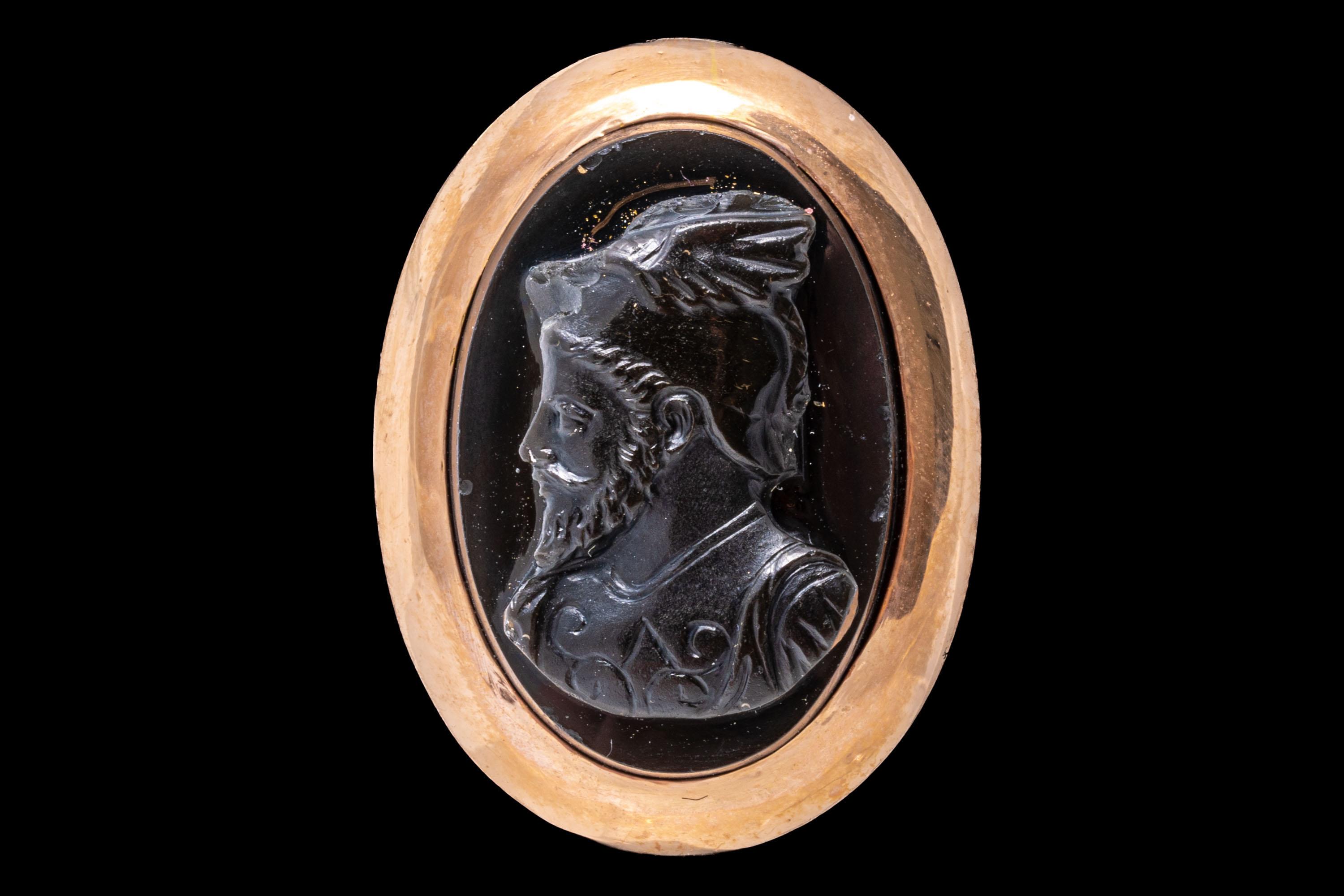 14k rose gold ring. This striking vintage oval black onyx cameo ring has a handsome bearded profile bust, facing to the left, and set off with a wide, high polished frame.
Marks: None, tests 14k
Dimensions: 5/8