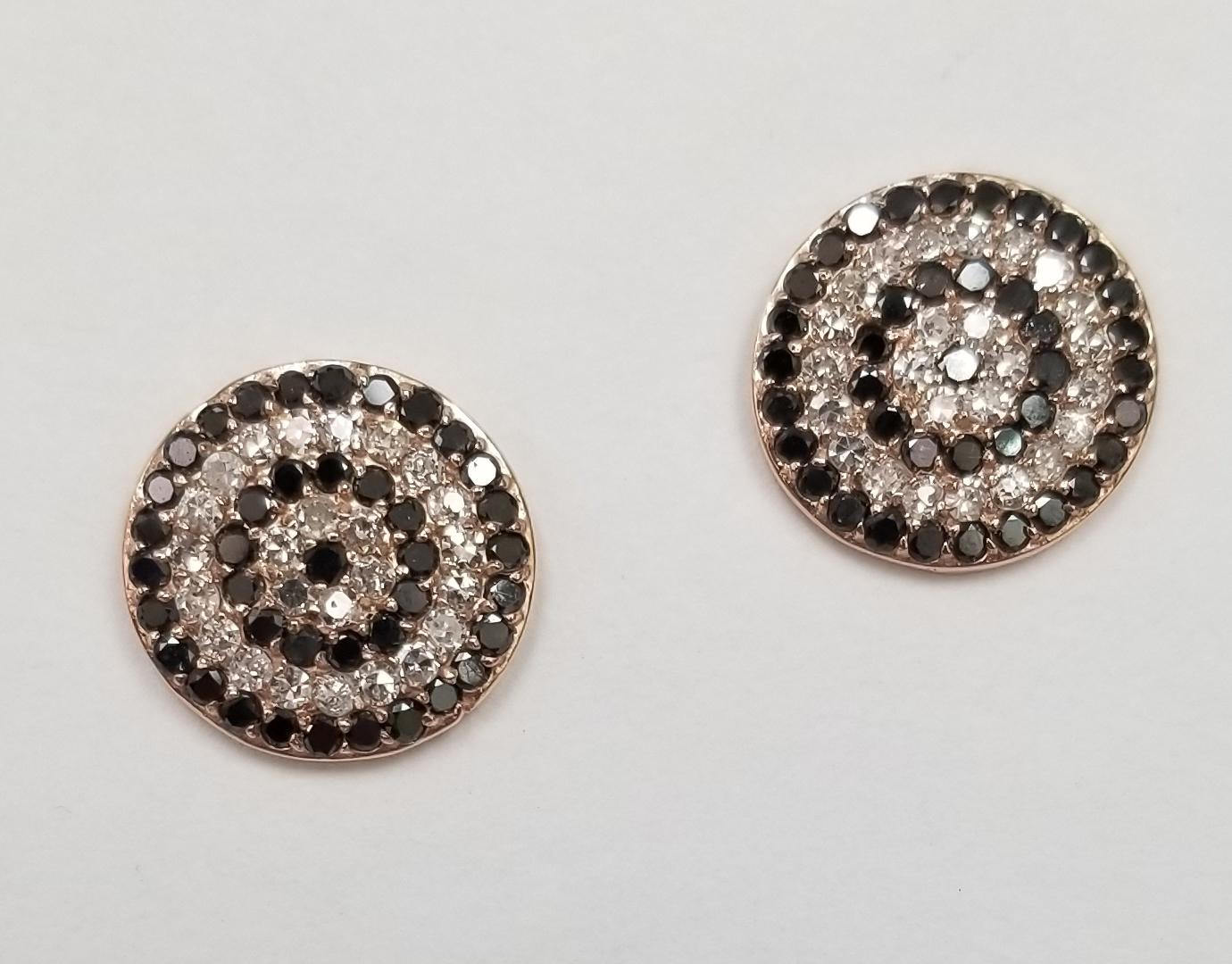  14k rose gold white and black diamond swirl earrings
Specifications:
    main stone: 50 pcs white single diamonds .50pts.
    stones: 80 pcs black diamonds .80pts. 
    color: F-G
    clarity:  VS2-SI1
    brand: NONE
    metal: 14K rose gold
   