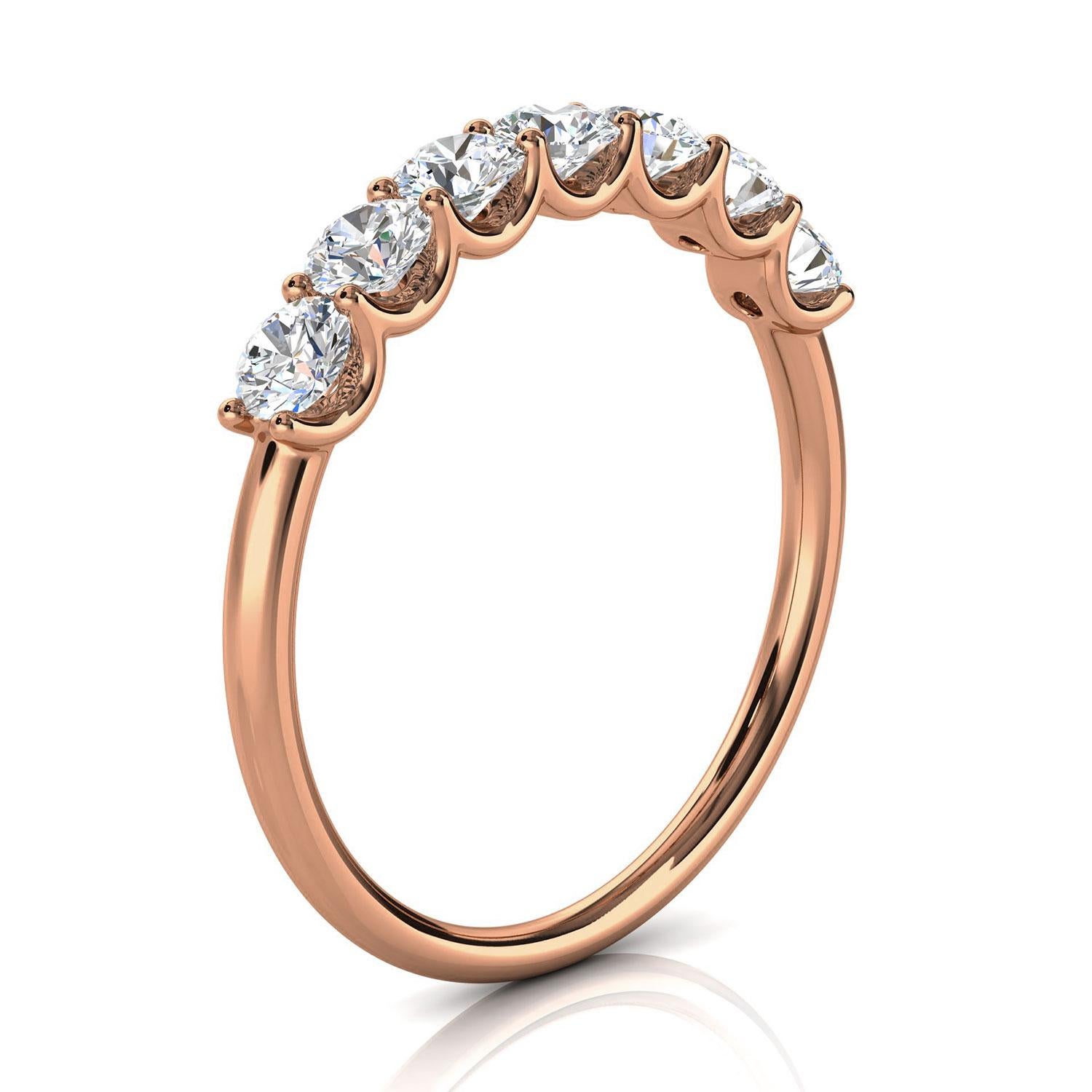 This Delicate ring features Seven (7) floating Brilliante round diamonds set in 