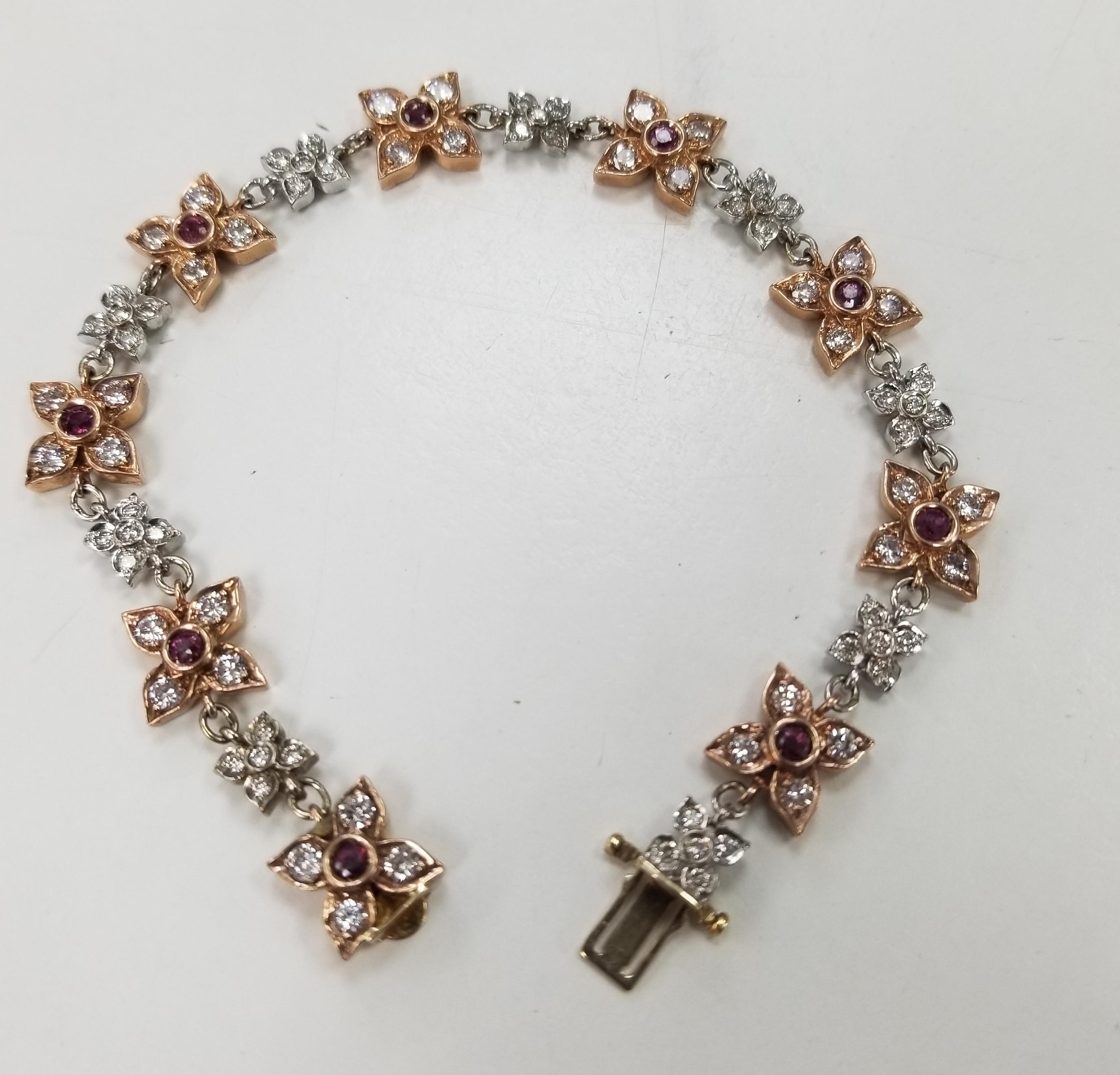 14k rose-white gold ruby and diamond floral bracelet, containing 81 round full cut diamonds of very fine quality weighing 2.16cts. and 9 round rubies of gem quality weighing .90pts. bracelet measures 7.25 inches.