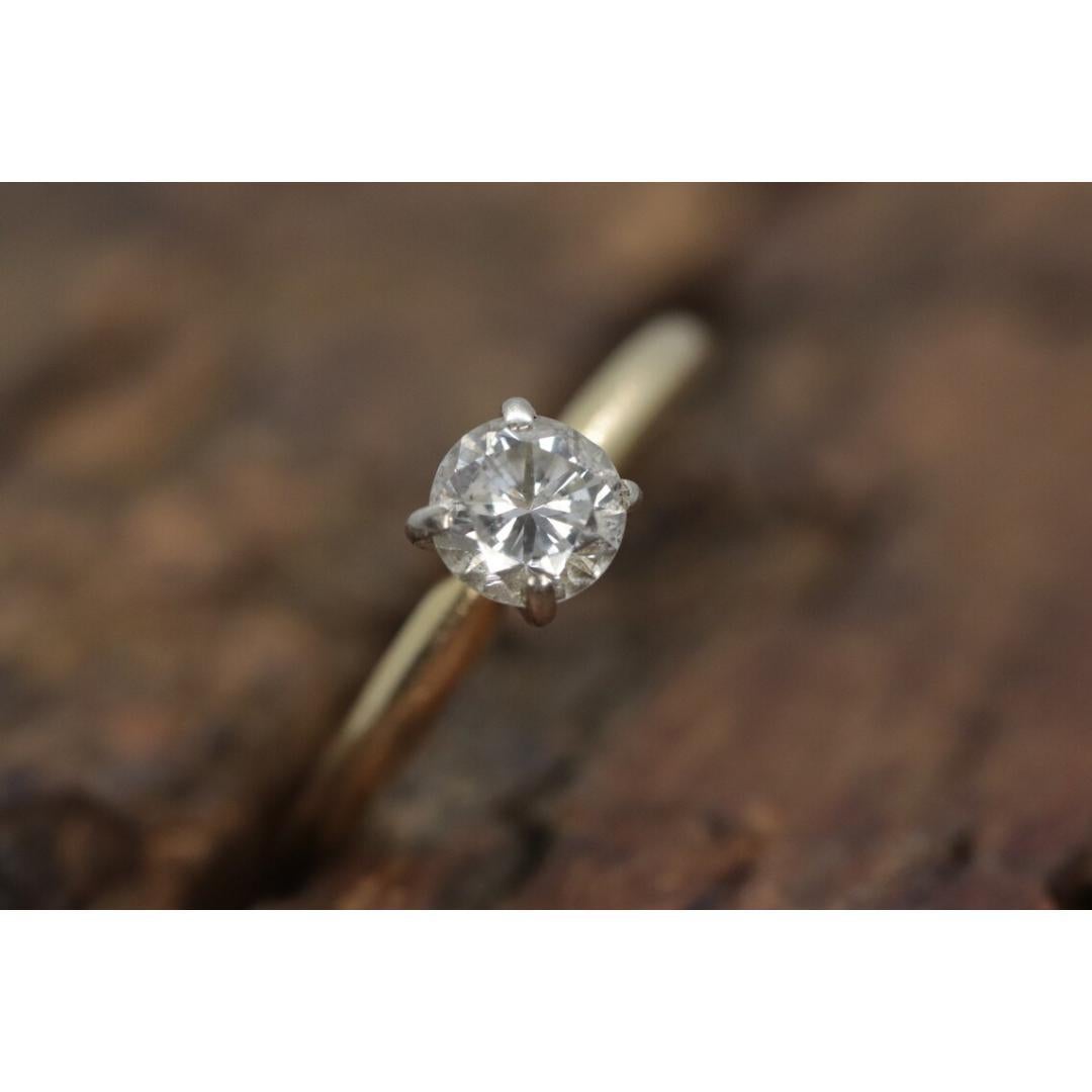 Vintage from the 1990s
Size: 5 1/2 US
Materials: Rose gold
Gemstone: Diamond
Gem color: Colorless
Band color: Yellow

Style: Minimalist

About this item

Petite engagement ring. High Quality Round Diamond solitaire prong set.

Condition: Band has