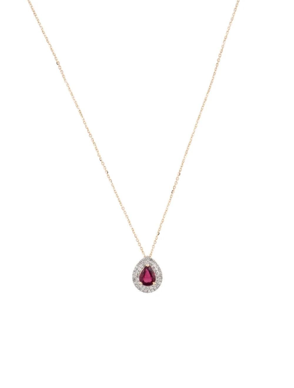 Experience timeless elegance with this exquisite 14K Yellow Gold Pendant Necklace featuring a stunning Pear Modified Brilliant Rubellite. Perfect for adding a pop of vibrant color to any ensemble, this necklace exudes sophistication and charm. Here