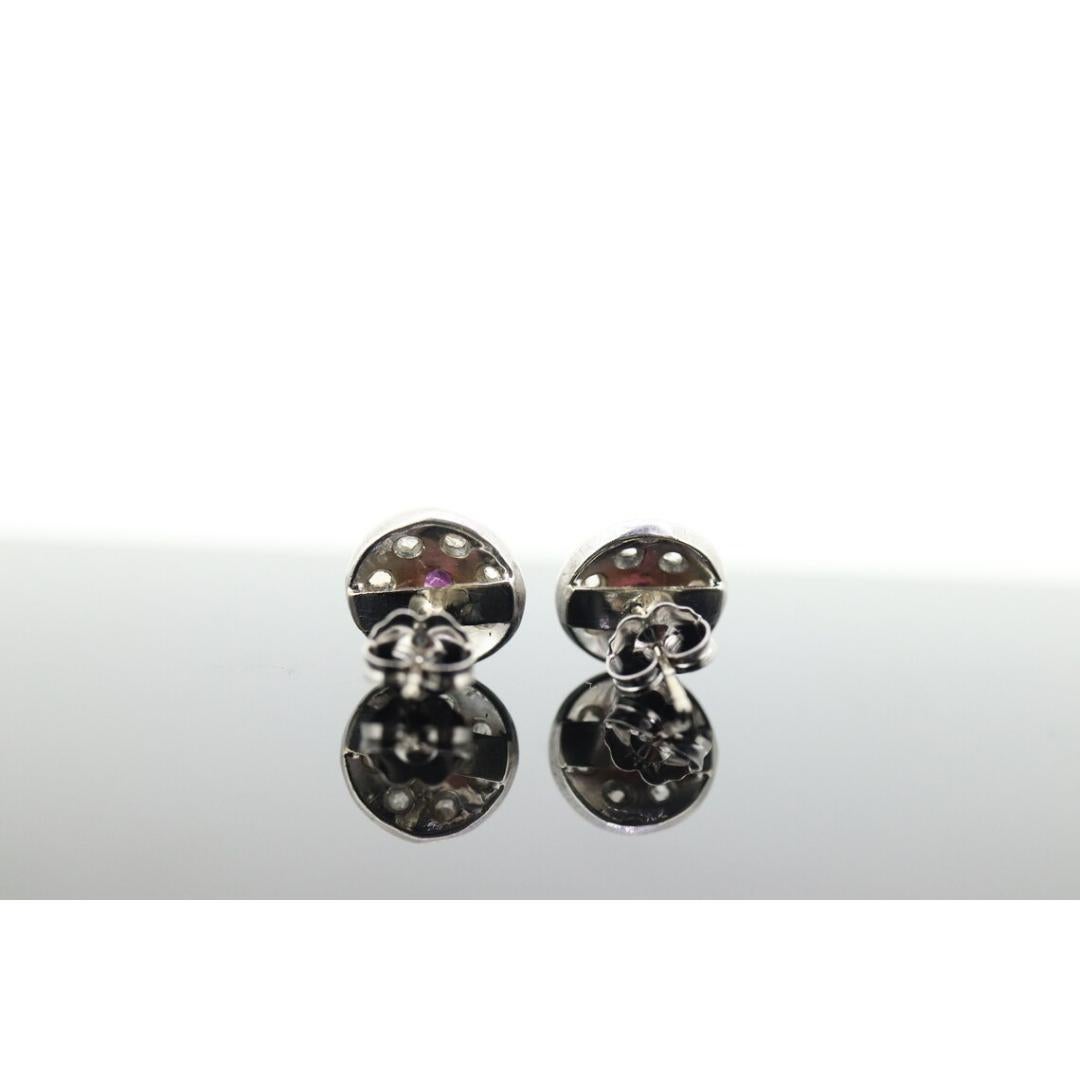 Vintage from the 1960s
Materials: Stone
Gemstone: Ruby
Location: Earlobe
Closure: Push back

Style: Mid-century

Beautiful dainty earrings. They are vintage of age. Composed of oval round rubies and rough cut diamond halo. Earrings are 14k white