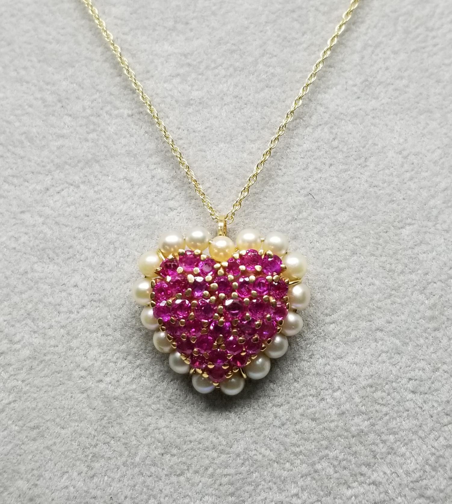 14k yellow gold Ruby and Pearl pendant containing 28 round 
