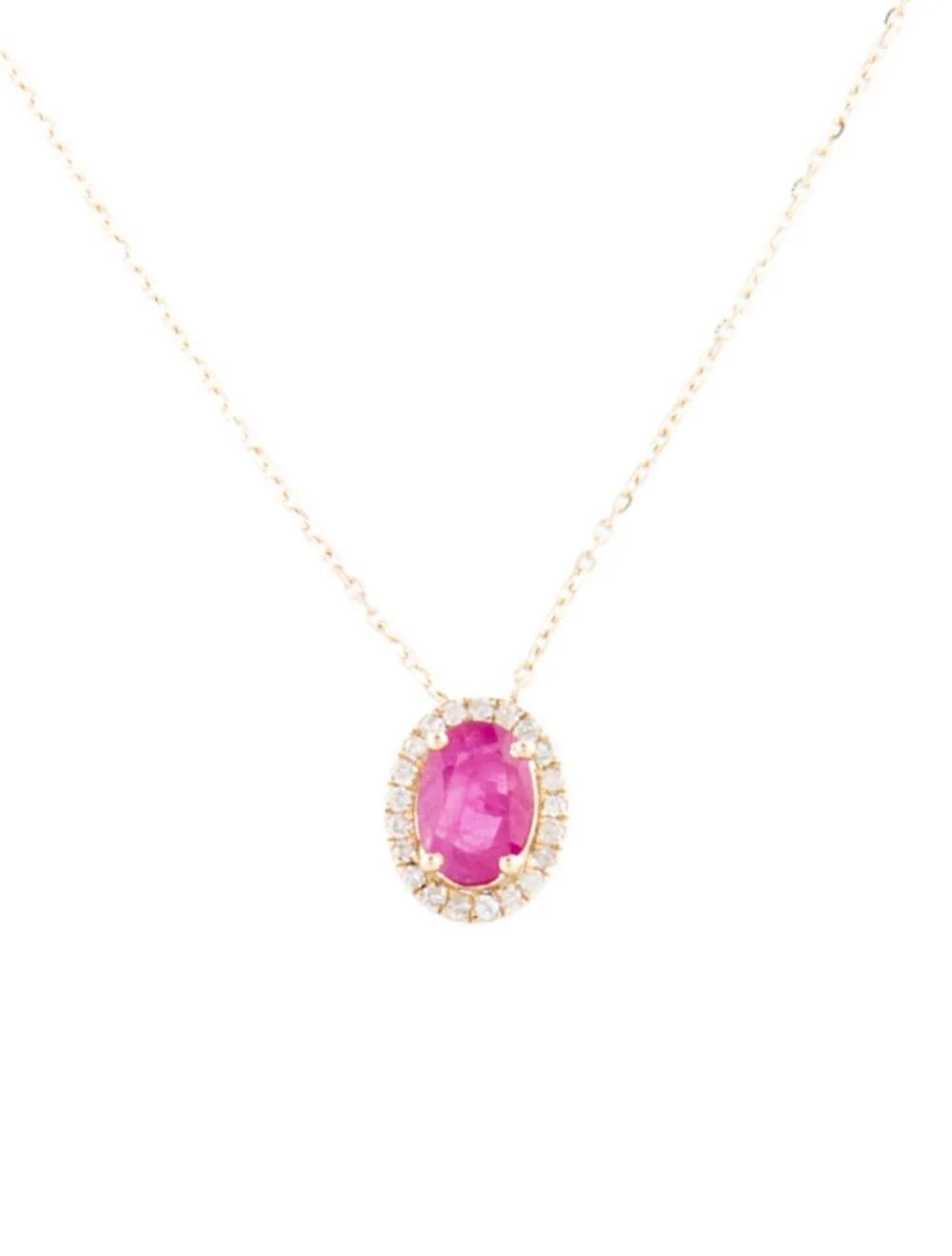 Introducing our exquisite 14K Yellow Gold Necklace, adorned with a captivating 0.95 Carat Oval Modified Brilliant Ruby at its center, encircled by a halo of shimmering Diamonds. Crafted to perfection, this timeless piece exudes elegance and