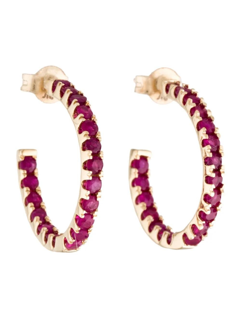 Enhance your elegance with these exquisite 14K Yellow Gold Ruby Inside-Out Hoop Earrings, a perfect blend of sophistication and charm.

Specifications:

* Metal Type: 14K Yellow Gold
* Gemstone: Ruby
* Carat Weight: 1.86
* Stone Count: 38
* Stone