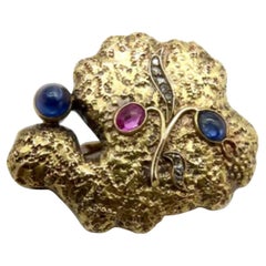 Broche orgánico de zafiro, diamante y rubí de oro ruso de 14 quilates, hacia 1922