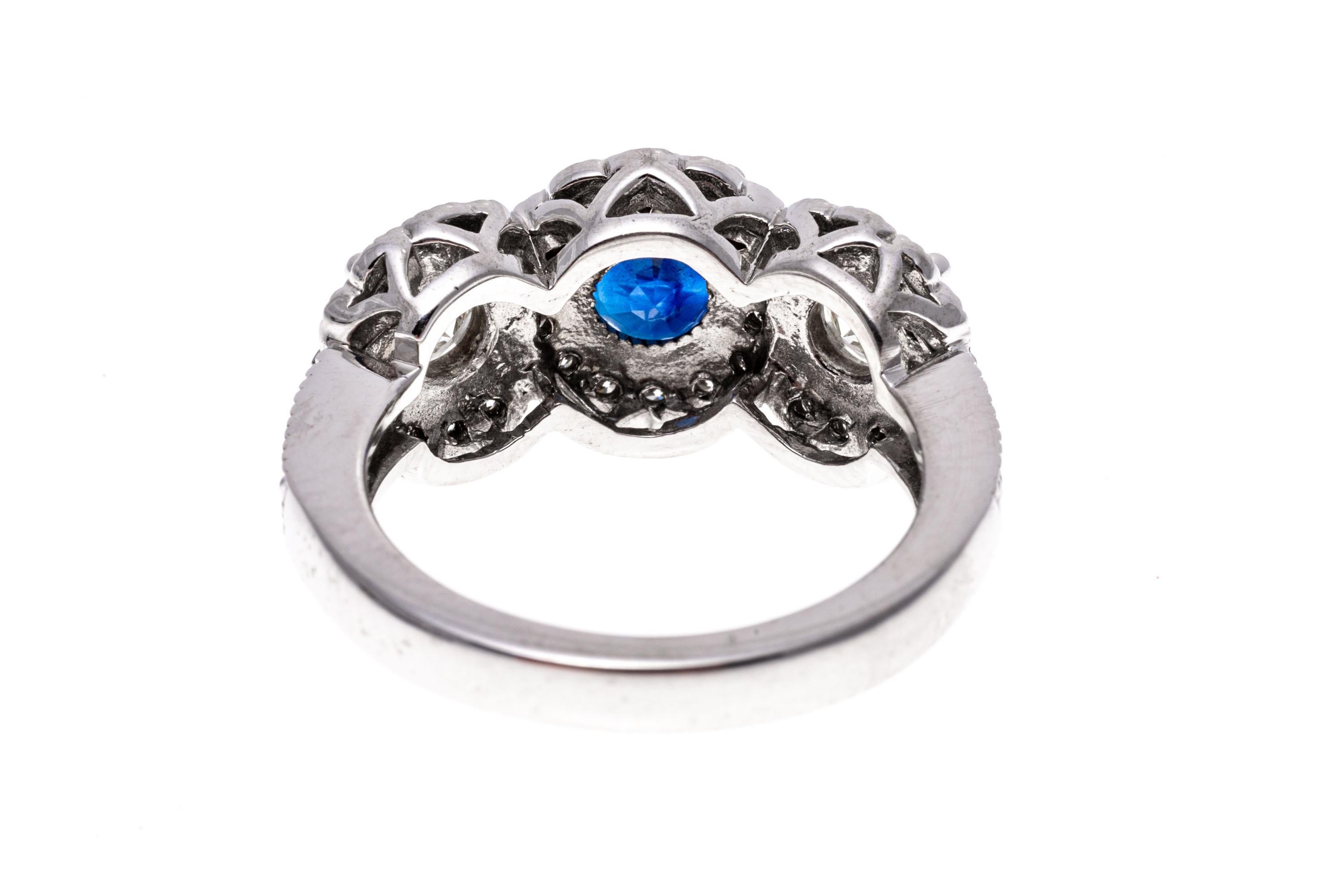 14k White Gold Blue Sapphire and Diamond Halo Three Stone Ring, App. 0.57 TCW In Good Condition For Sale In Fairfield, CT