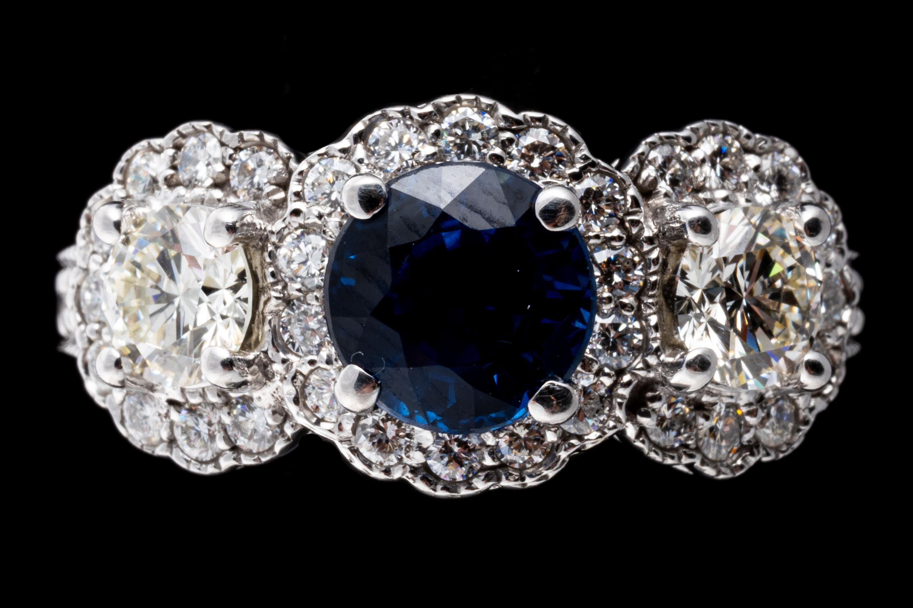 Women's 14k White Gold Blue Sapphire and Diamond Halo Three Stone Ring, App. 0.57 TCW For Sale