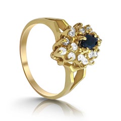 14 Karat Sapphire and Diamond Cluster Ring.